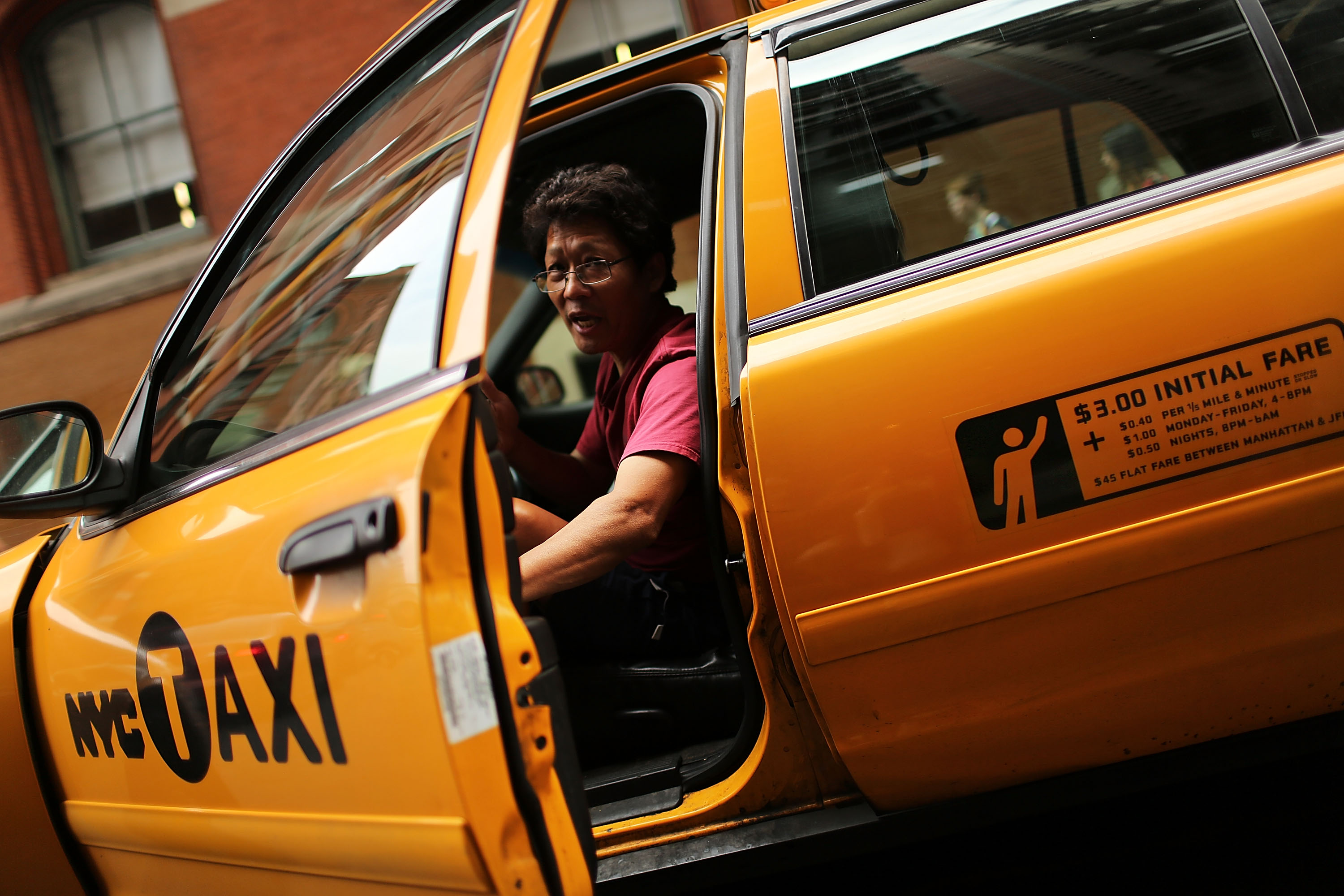 A taxi driver pauses in his vehicle on September 4, 2012 in New York City. (Spencer Platt&mdash;Getty Images)