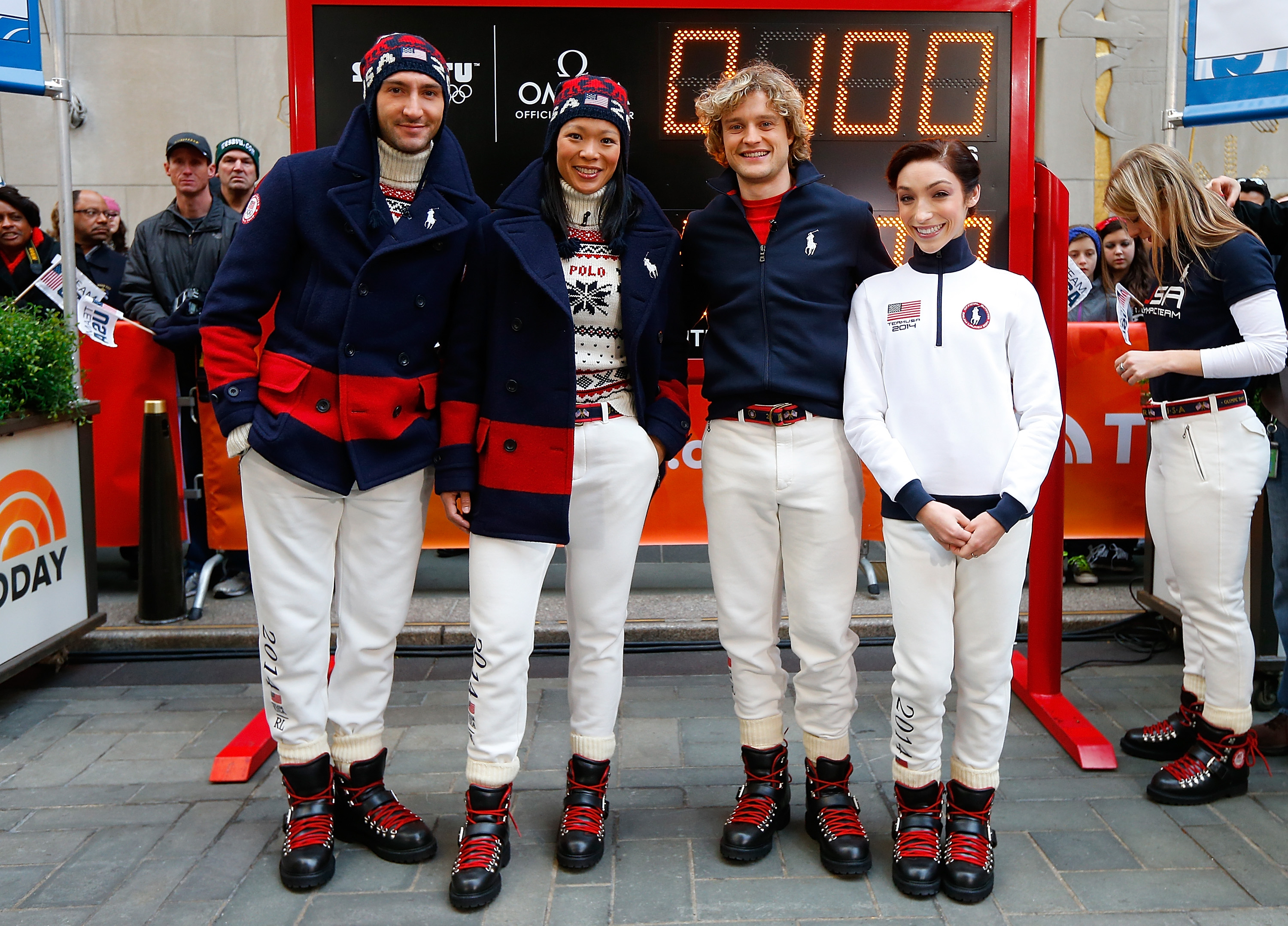 (L-R)Figure Skating Oympic Athlete Evan Lysacek, Ice Hockey Oympic Athlete Julie Chu, Ice Dancers Oympic Athlete Meryl Davis and Charlie White model the Olympic closing ceremony outfits by Ralph Lauren on Oct. 29, 2013 in New York City.