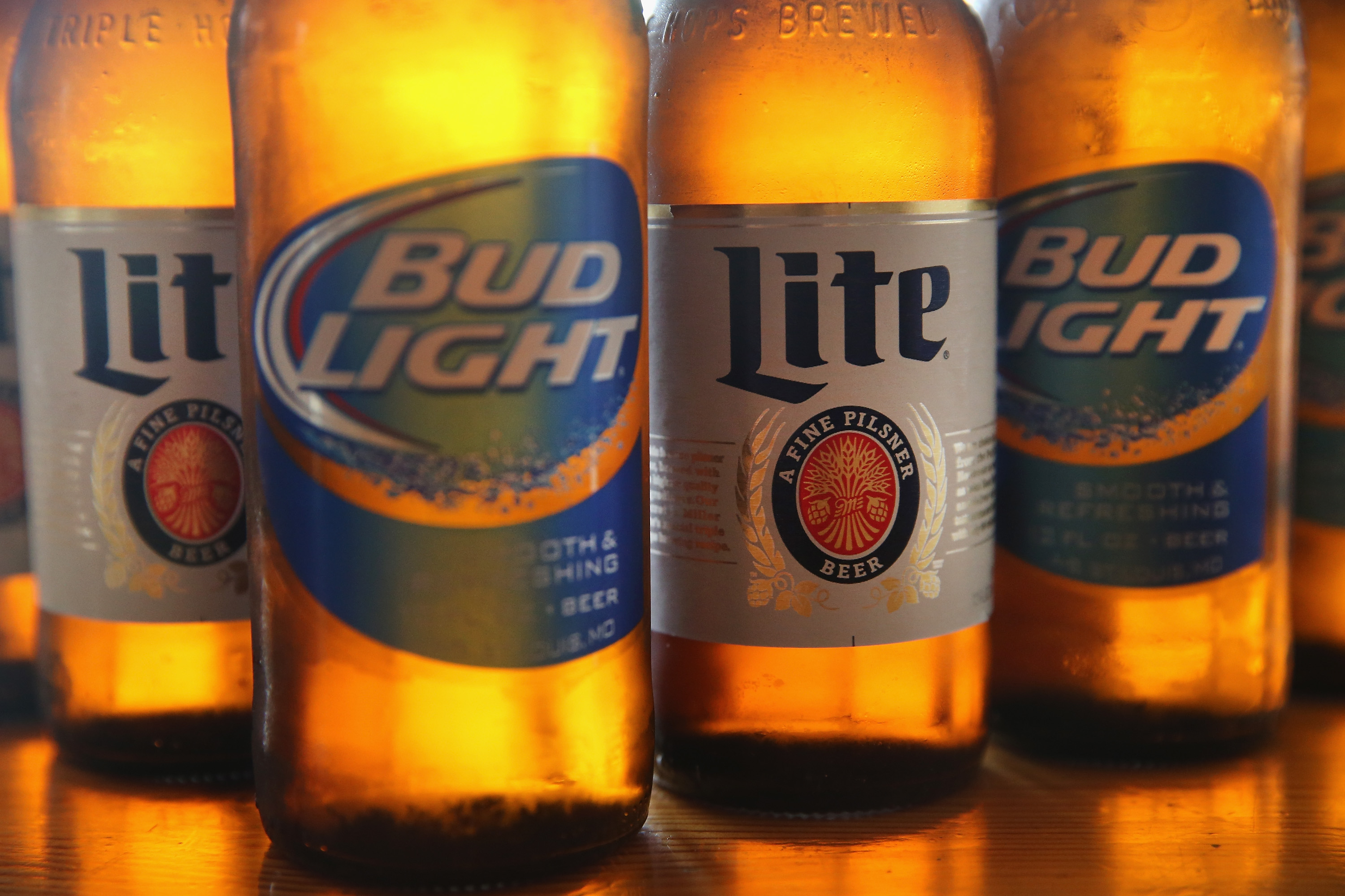 In this photo illustration, bottles of Miller Lite and Bud Light beer that are products of SABMiller and Anheuser-Busch InBev (respectively) are shown on September 15, 2014 in Chicago. Illinois. (Scott Olson&mdash;Getty Images)