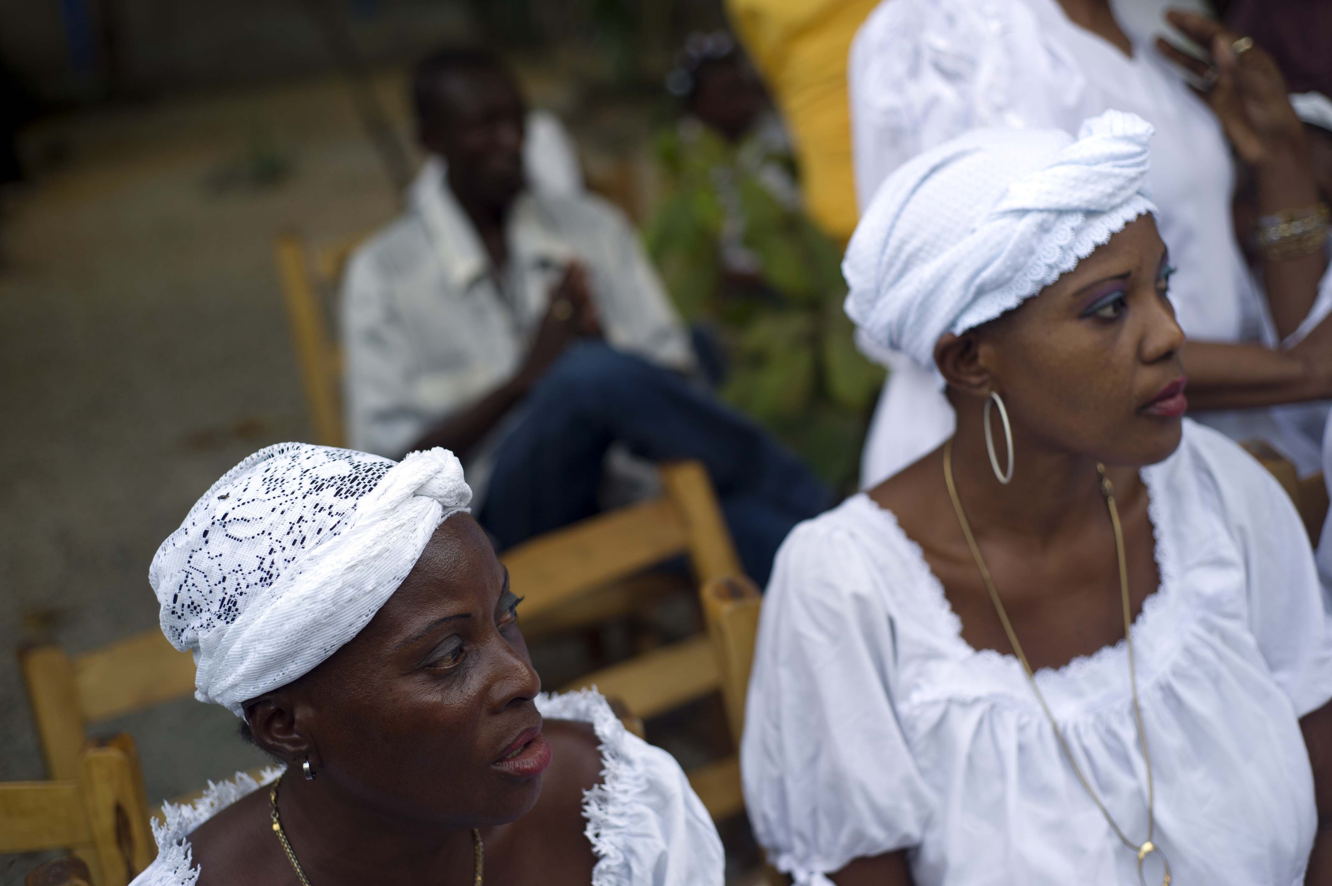 Women participate in a voodoo ceremony named Vohoun, in the National Bureau of Ethnology in Port-au-Prince on Jan. 12, 2015. (Hector Retamal—AFP/Getty Images)