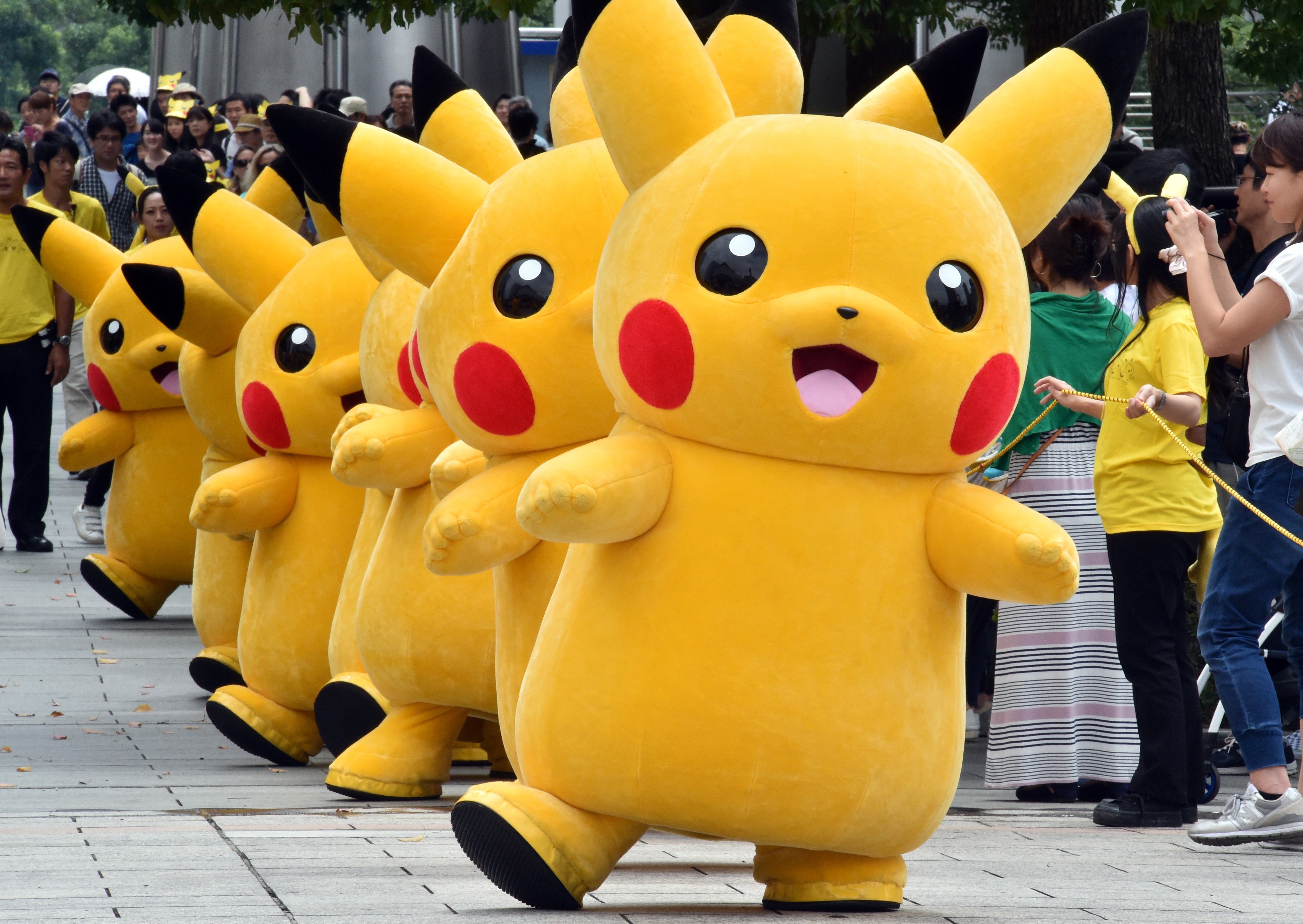 Dozens of Pikachu characters, the famous character of Nintendo's videogame software Pokemon, march at the Landmark Plaza shopping mall in Yokohama, suburban Tokyo on August 13, 2015. (Yoshikazu Tsuno—AFP/Getty Images)
