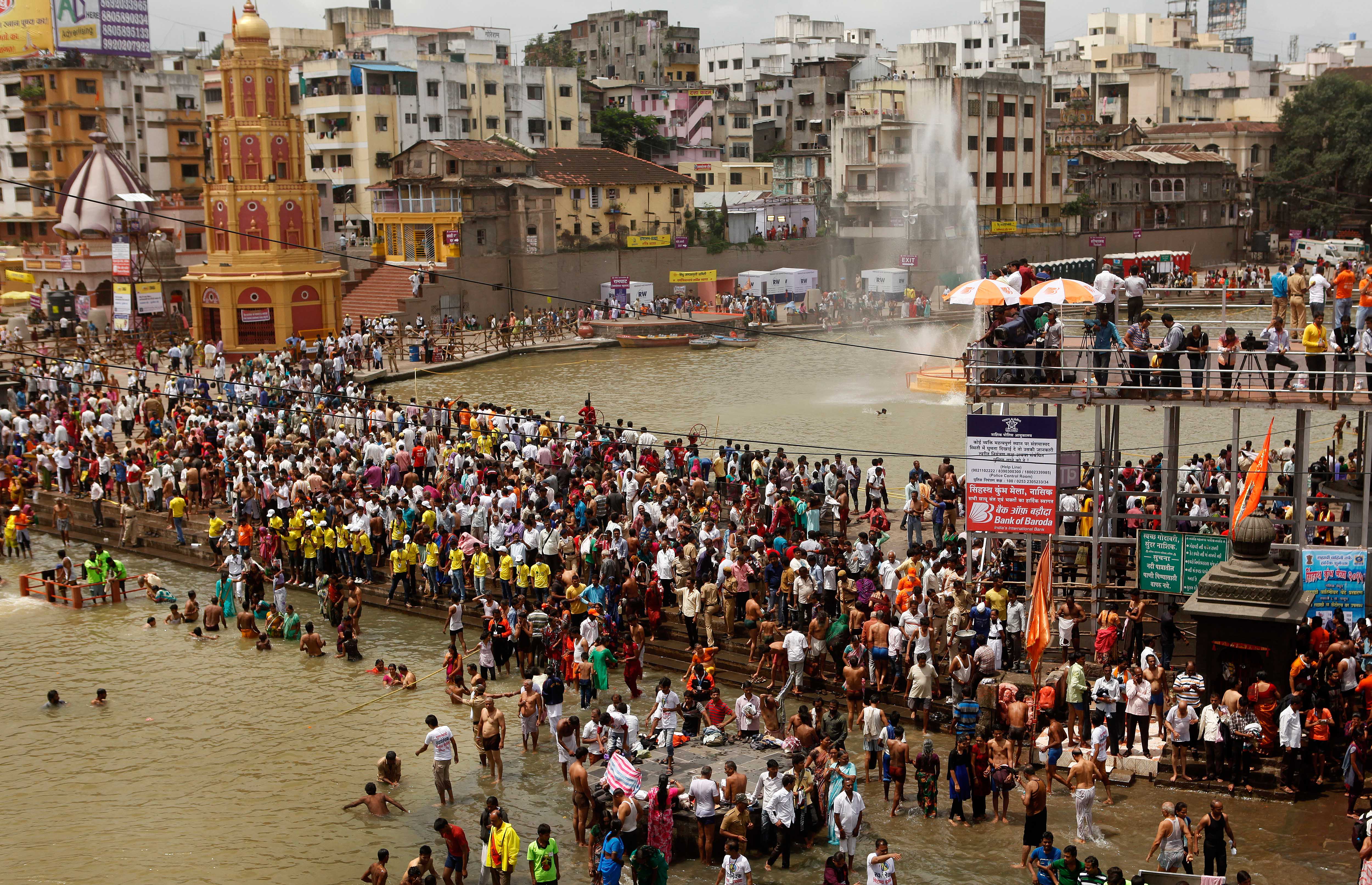 Devotees take holy dip at Ramkund during the Maha Kumbh Mela in Nashik, India, on Aug. 29, 2015.