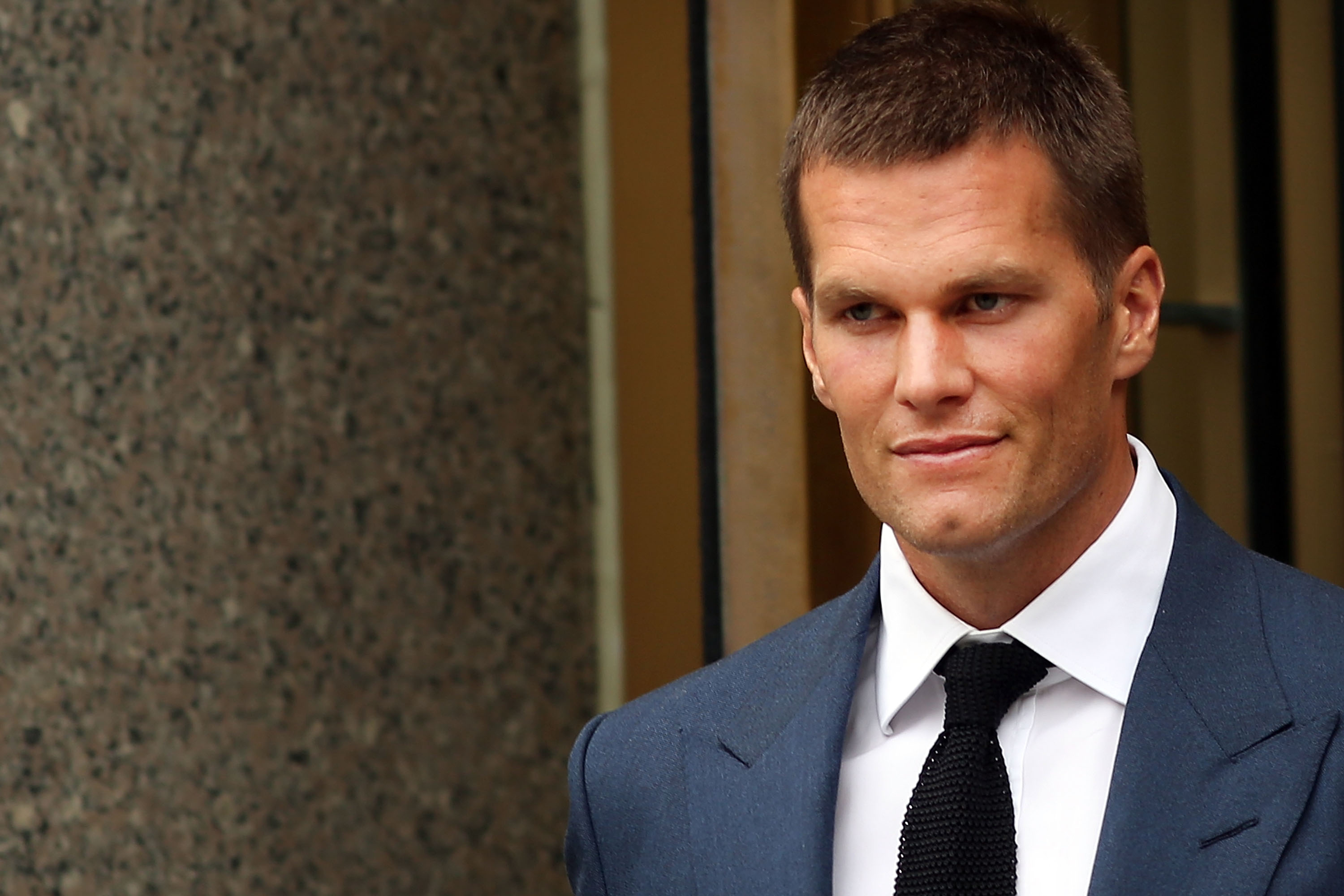 Quarterback Tom Brady of the New England Patriots leaves federal court after contesting his four game suspension with the NFL on August 31, 2015 in New York City. (Spencer Platt—Getty Images)
