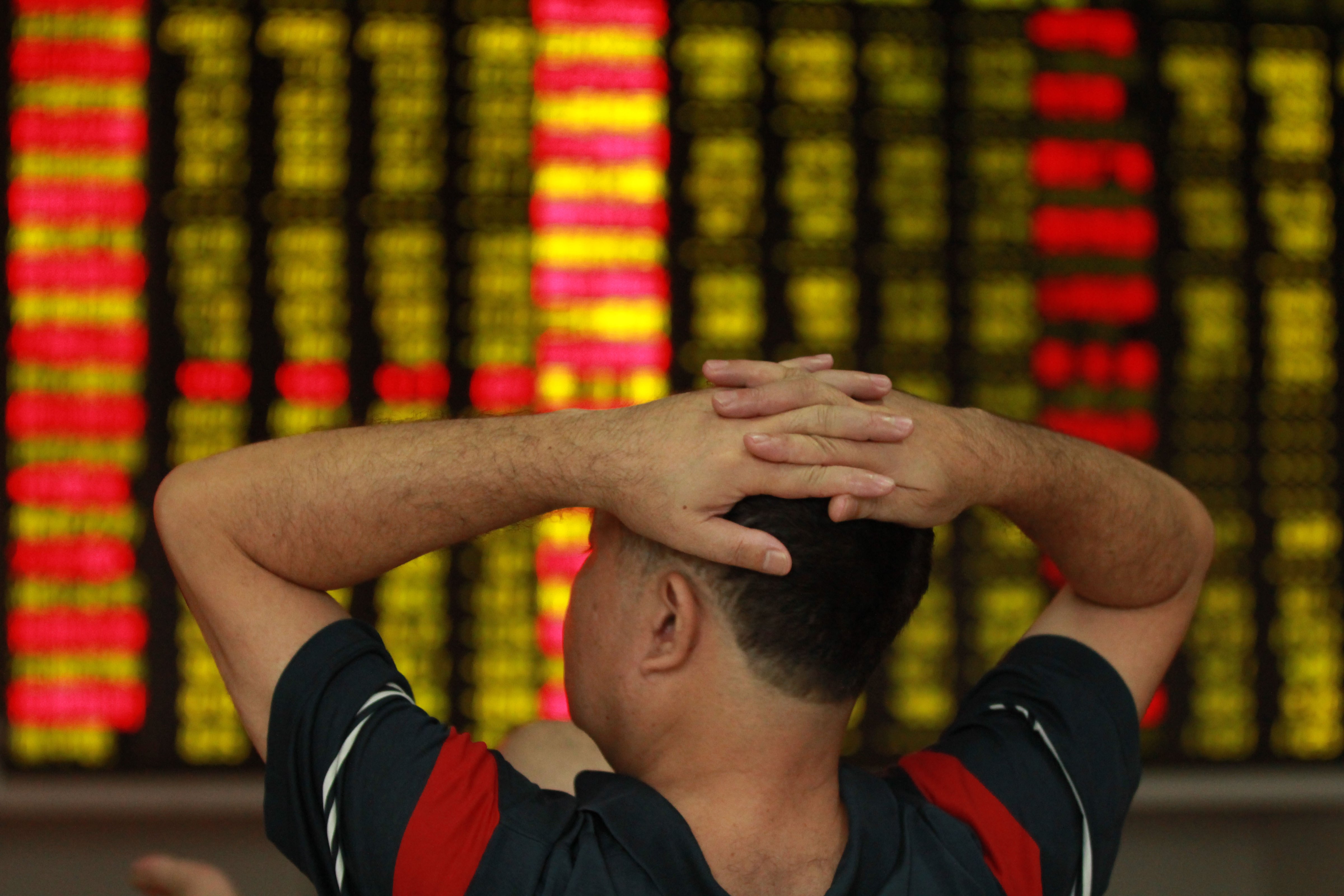 An investor observes stock market at a stock exchange hall on September 2, 2015 in Haikou, Hainan Province of China. (ChinaFotoPress&mdash;ChinaFotoPress via Getty Images)