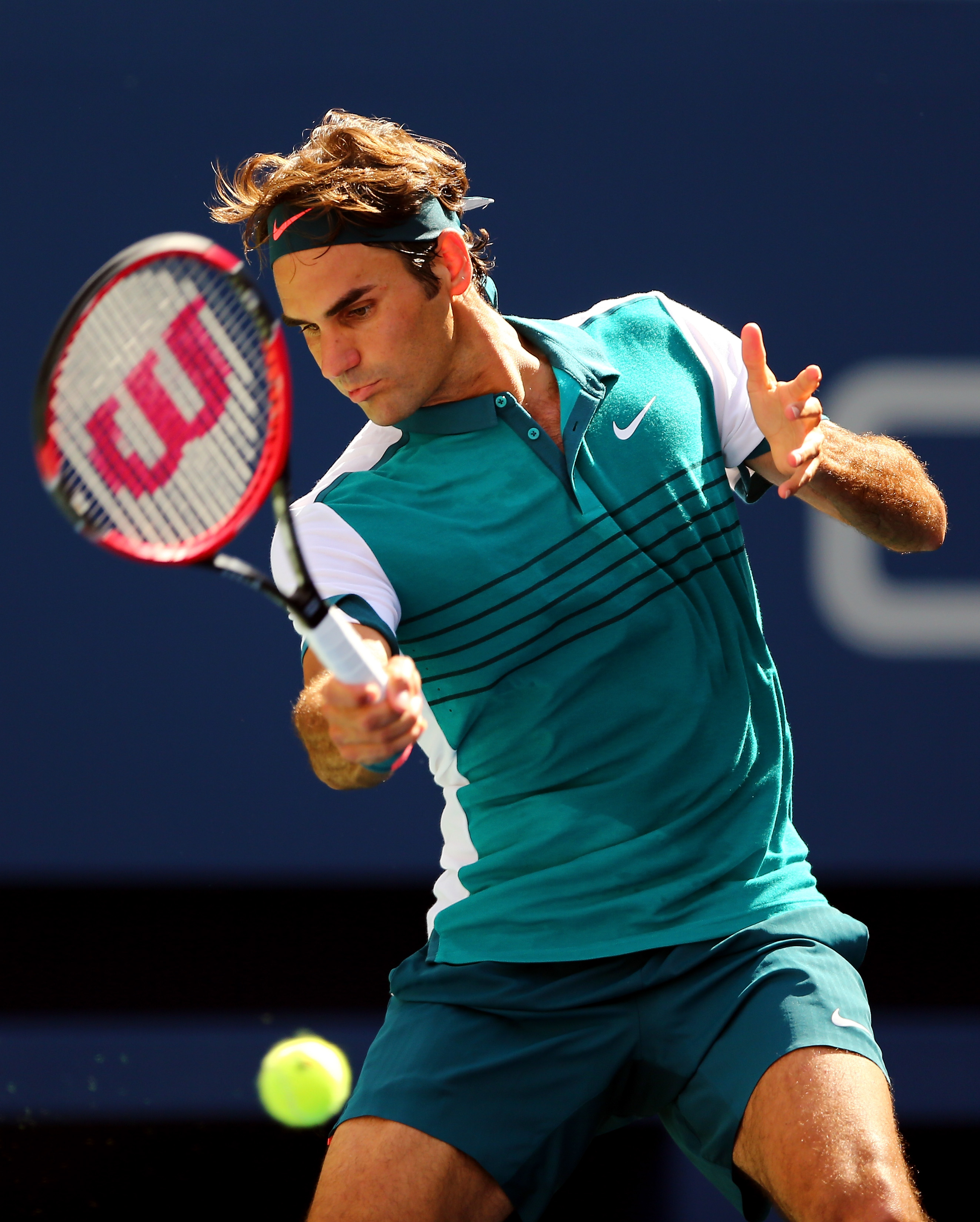 Roger Federer of Switzerland returns a shot to Philipp Kohlschreiber of Germany during their Men's Singles Third Round match on Day Six of the 2015 US Open on Sept. 5, 2015 .