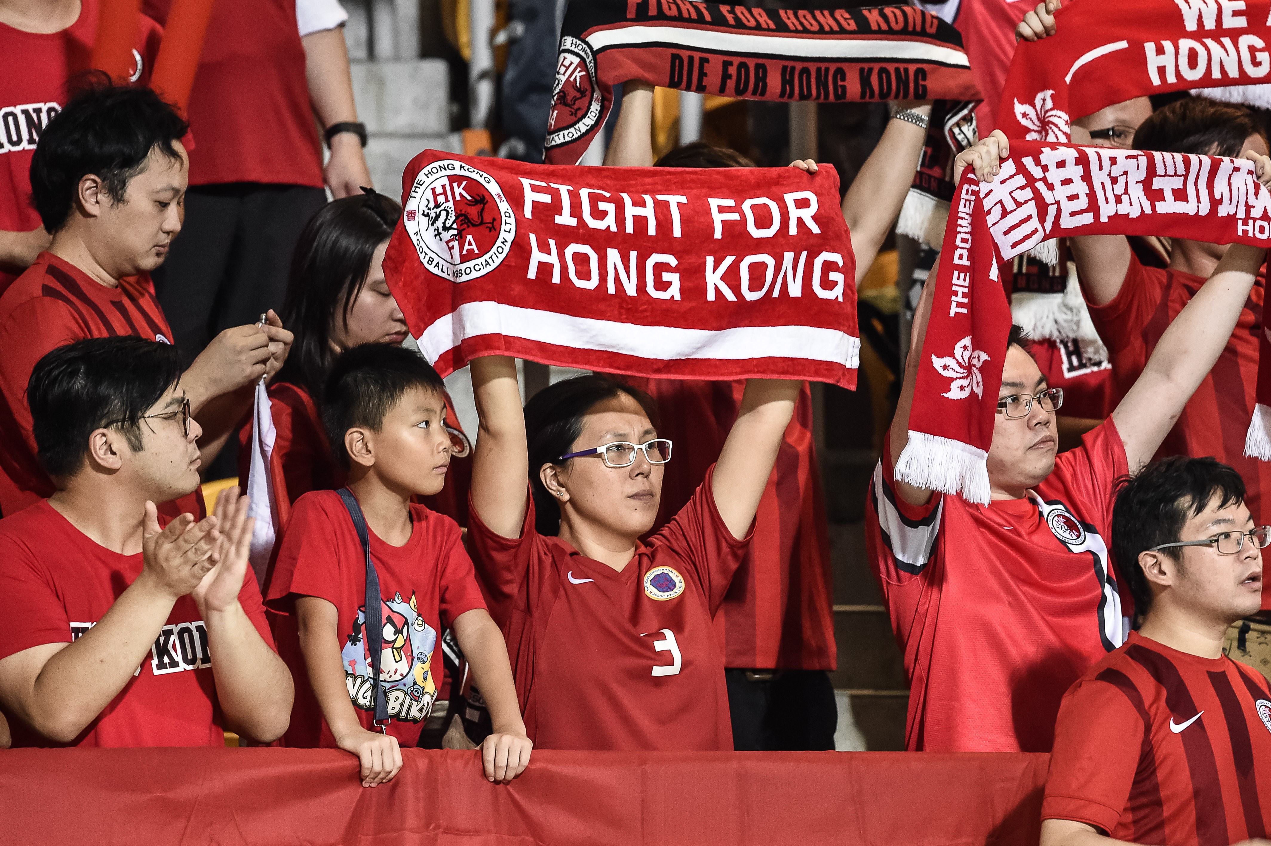 Hong Kong football fans during the 2018 World Cup football qualifying match between Hong Kong and Qatar in Hong Kong on Sept. 8, 2015. The Hong Kong Football Association said they would be "disappointed" if FIFA punished them after fans jeered the Chinese national anthem before they game (Philippe Lopez—AFP/Getty Images)