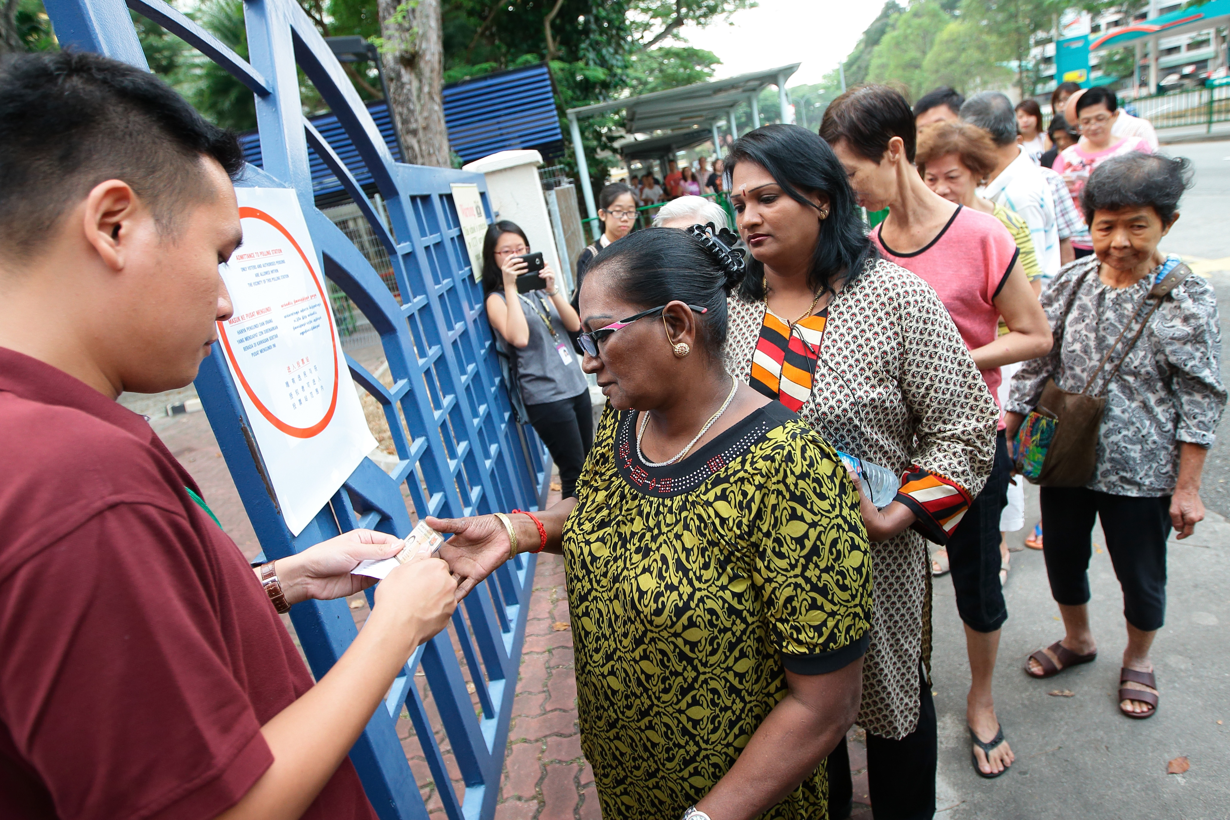 Voters line up to cast their ballots at a polling station on Sept. 11, 2015, in Singapore (Suhaimi Abdullah—Getty Images)