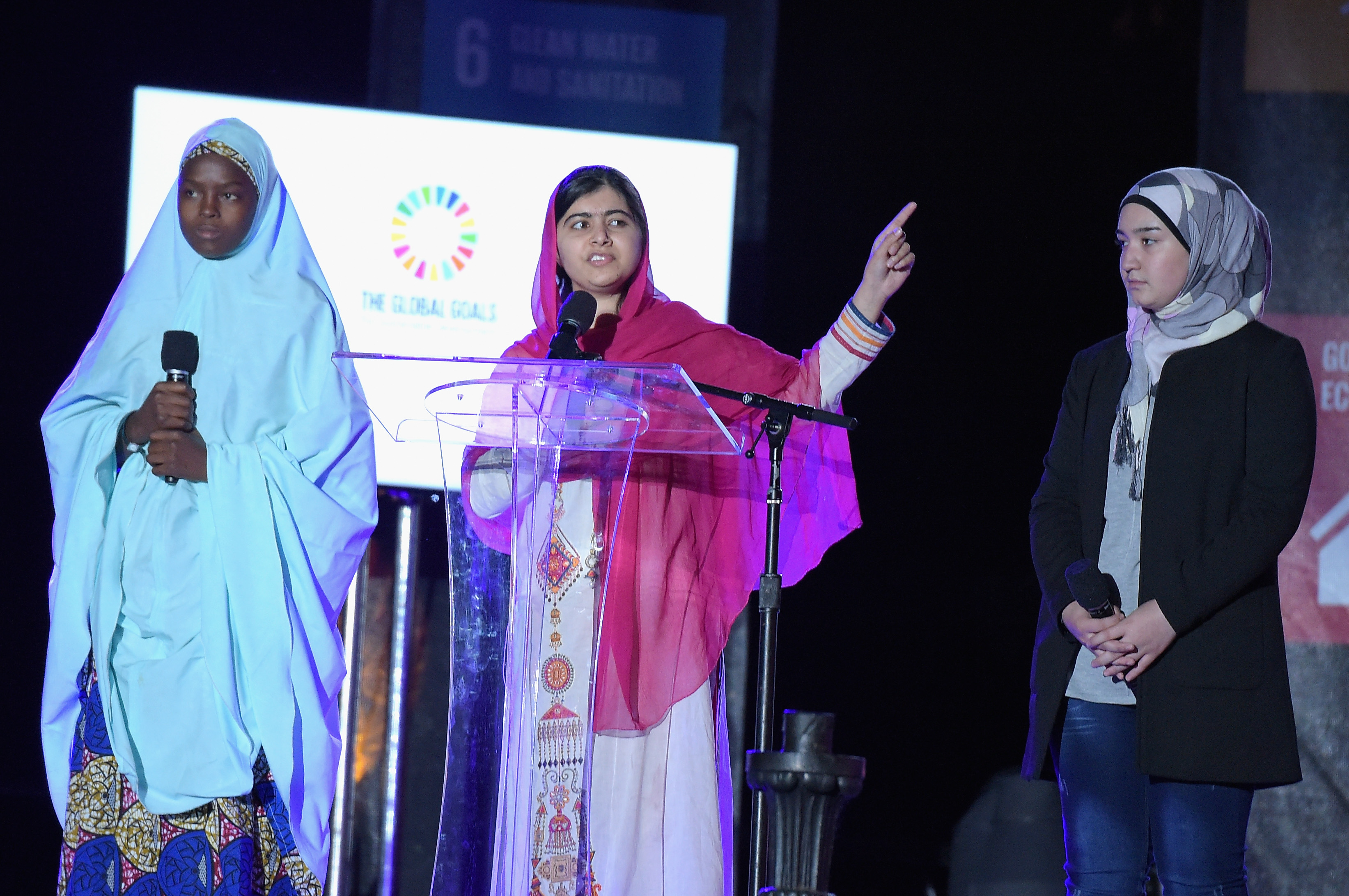Activist Malala Yousafzai, center, speaks on stage at the 2015 Global Citizen Festival to end extreme poverty by 2030 in Central Park in New York City on Sept. 26, 2015 (Theo Wargo—Getty Images)