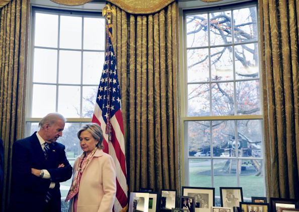 US Vice President Joe Biden (L) talks with Secretary of State Hillary Clinton as US President Barack Obama hosts a meeting with Turkish Prime Minister Recep Tayyip Erdogan in the Oval Office at the White House in Washington, DC, on December 7, 2009.