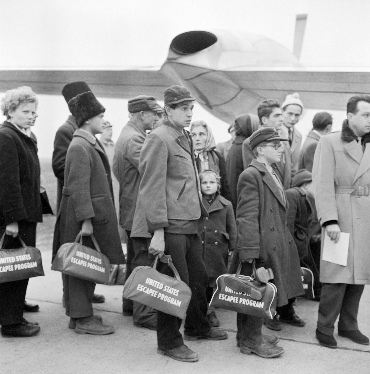 Hungarian refugees bording the plane for America