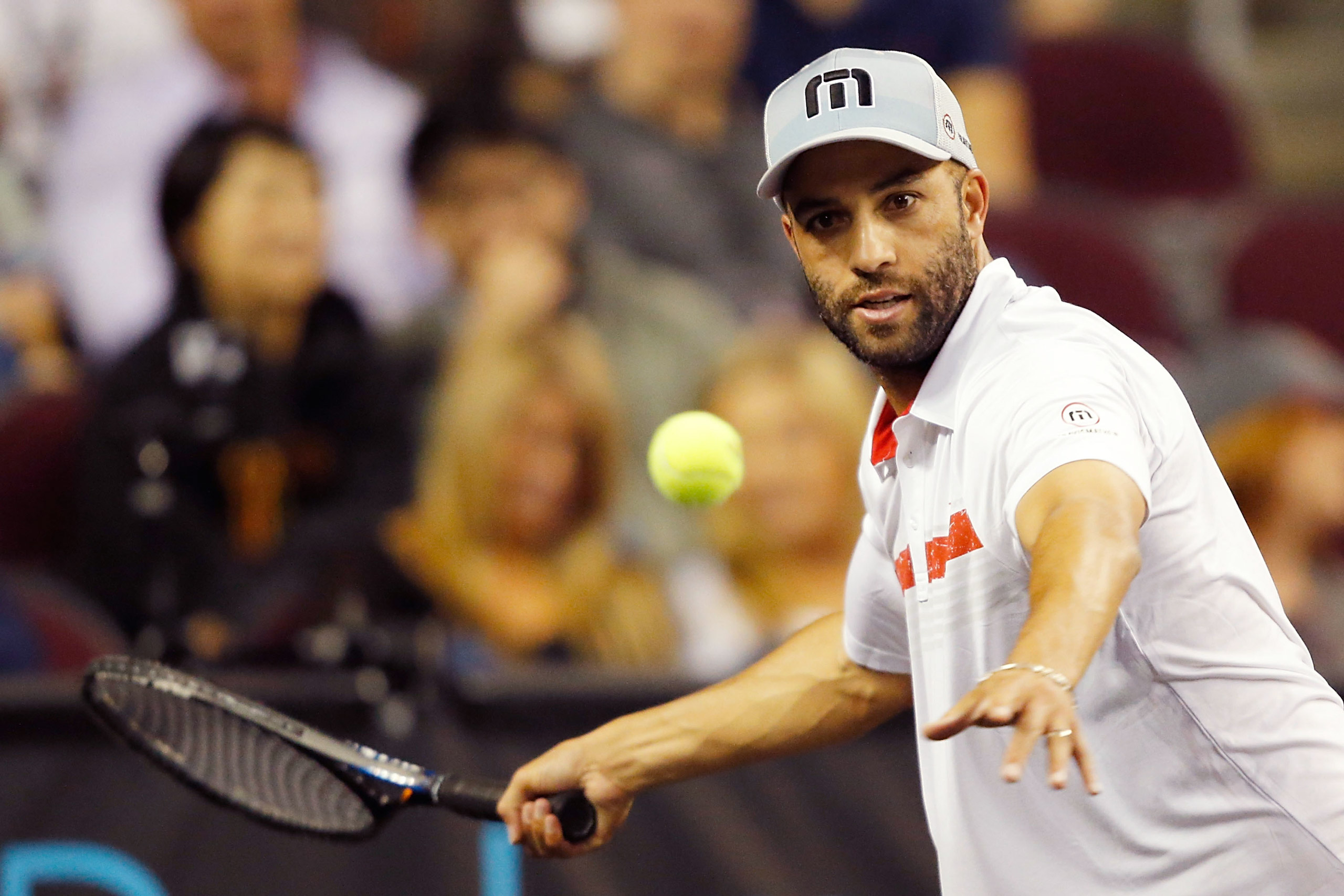 James Blake returns a shot to Andy Roddick during the PowerShares Series SoCal Honda Dealers Helpful Cup at Galen Center on March 25, 2015 . (Joe Scarnici—Getty Images)
