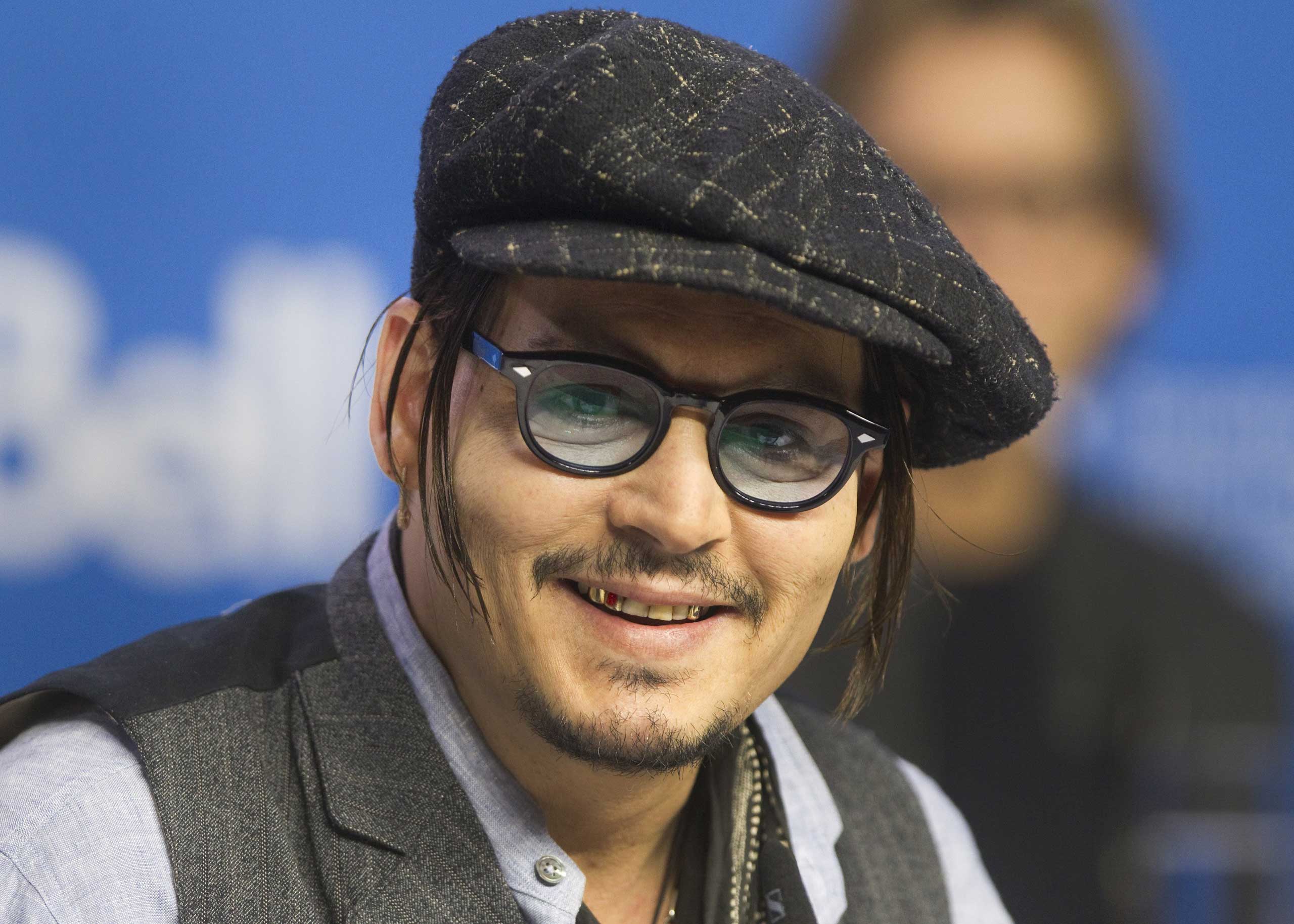 Johnny Depp attends a news conference to promote the film "Black Mass" at TIFF the Toronto International Film Festival in Toronto, Sept. 14, 2015. (Fred Thornhill—Reuters)