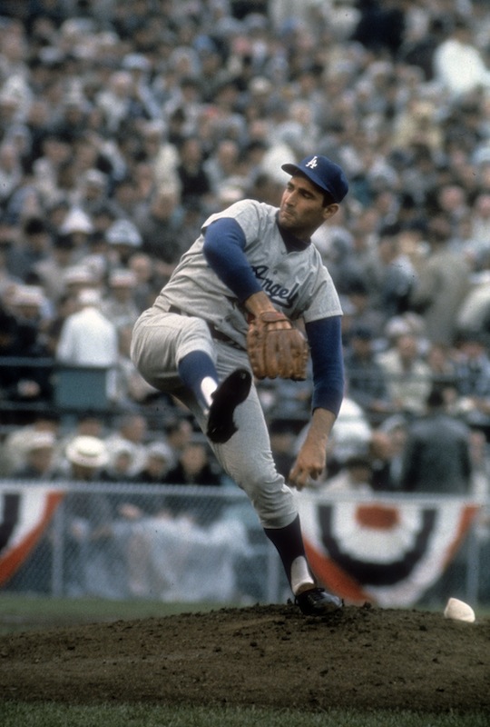 Pitcher Sandy Koufax of the Los Angeles Dodgers pitches against the Minnesota Twin in game 7 of the 1965 World Series, Oct. 14, 1965 at Metropolitan Stadium in Minneapolis. (Focus On Sport / Getty Images)