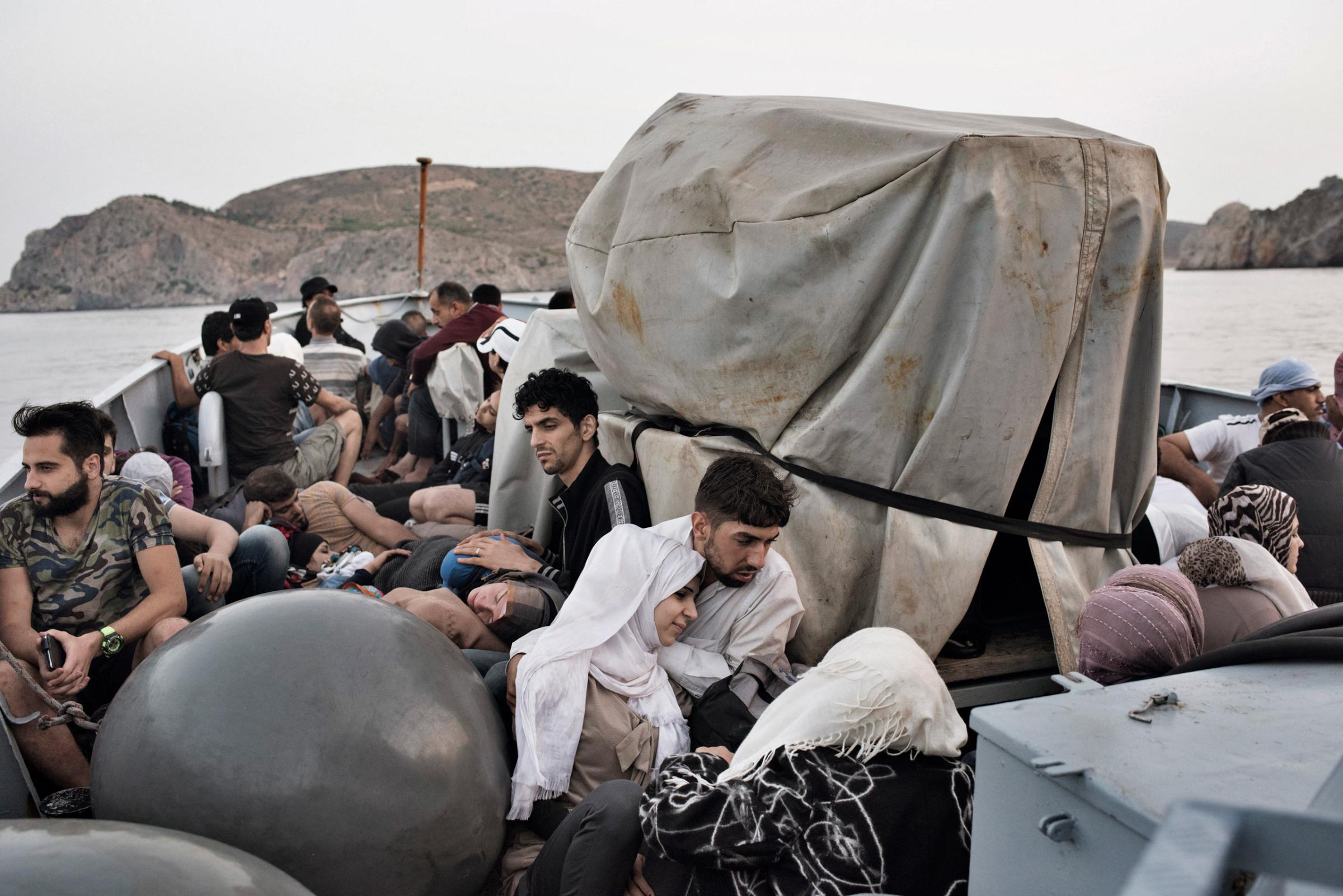 Syrian migrants are taken to Greece aboard a Greek coast guard vessel after it rescued them from waters near the Greek-Turkish border. Sept. 7, 2015.