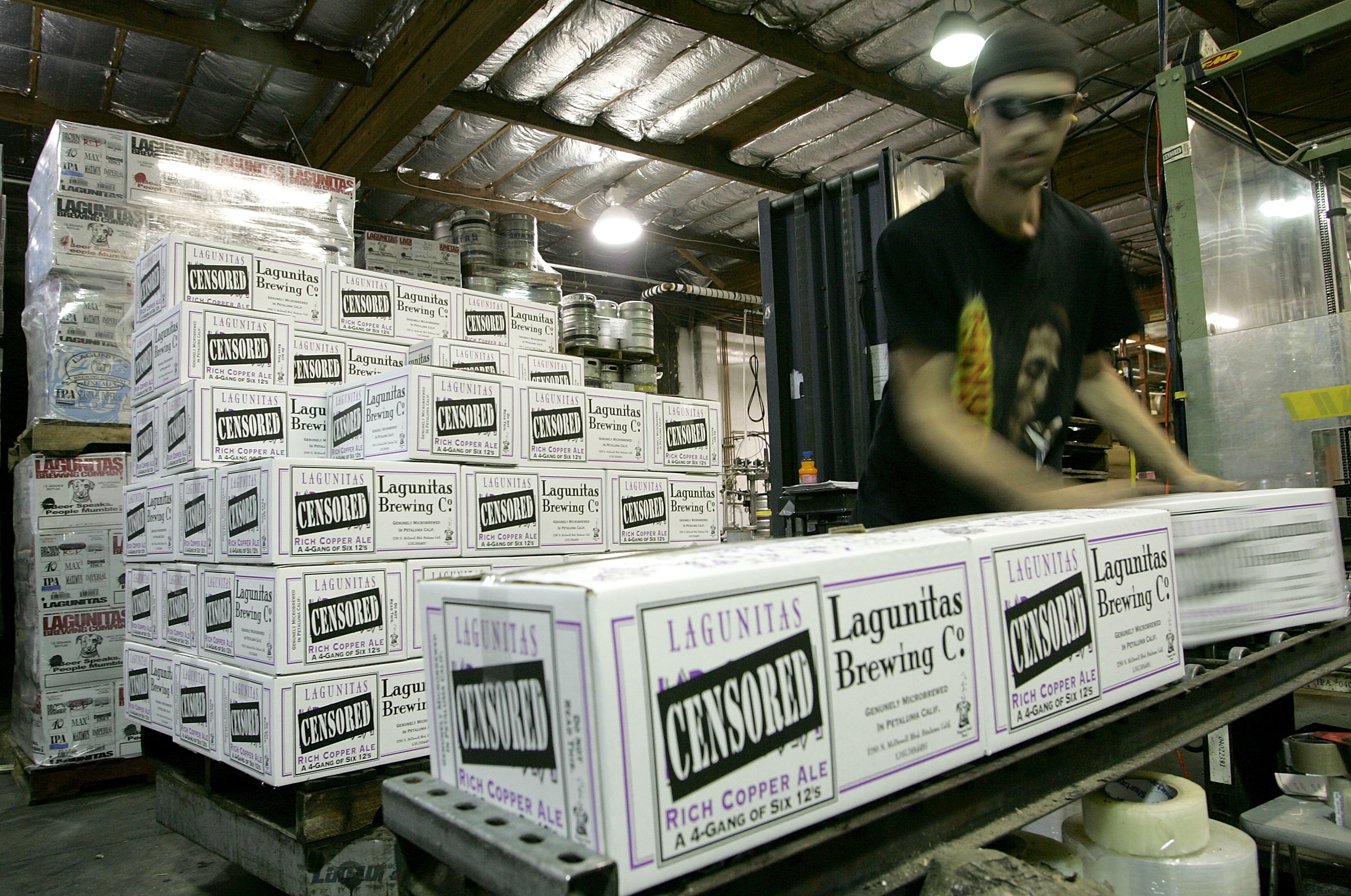 Lagunitas Brewing Company worker Paul Wickham stacks cases of beer at the brewery on March 28, 2006 in Petaluma, Calif. (Justin Sullivan—Getty Images)