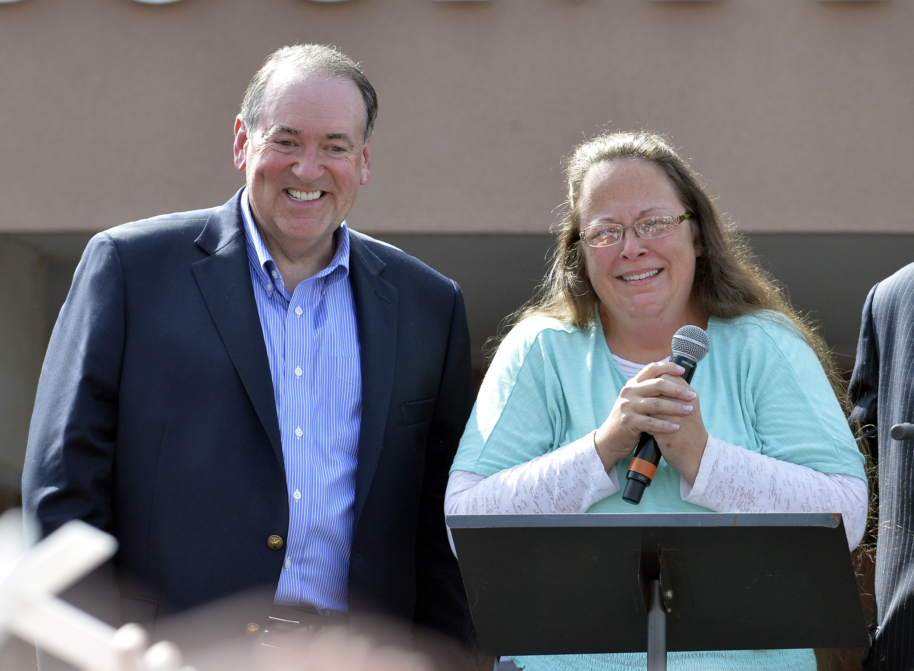 Rowan County Clerk Kim Davis, with Republican presidential candidate Mike Huckabee at her side, greets the crowd after being released from the Carter County Detention Center on Sept. 8, 2015, in Grayson, Ky. (Timothy D. Easley—AP)