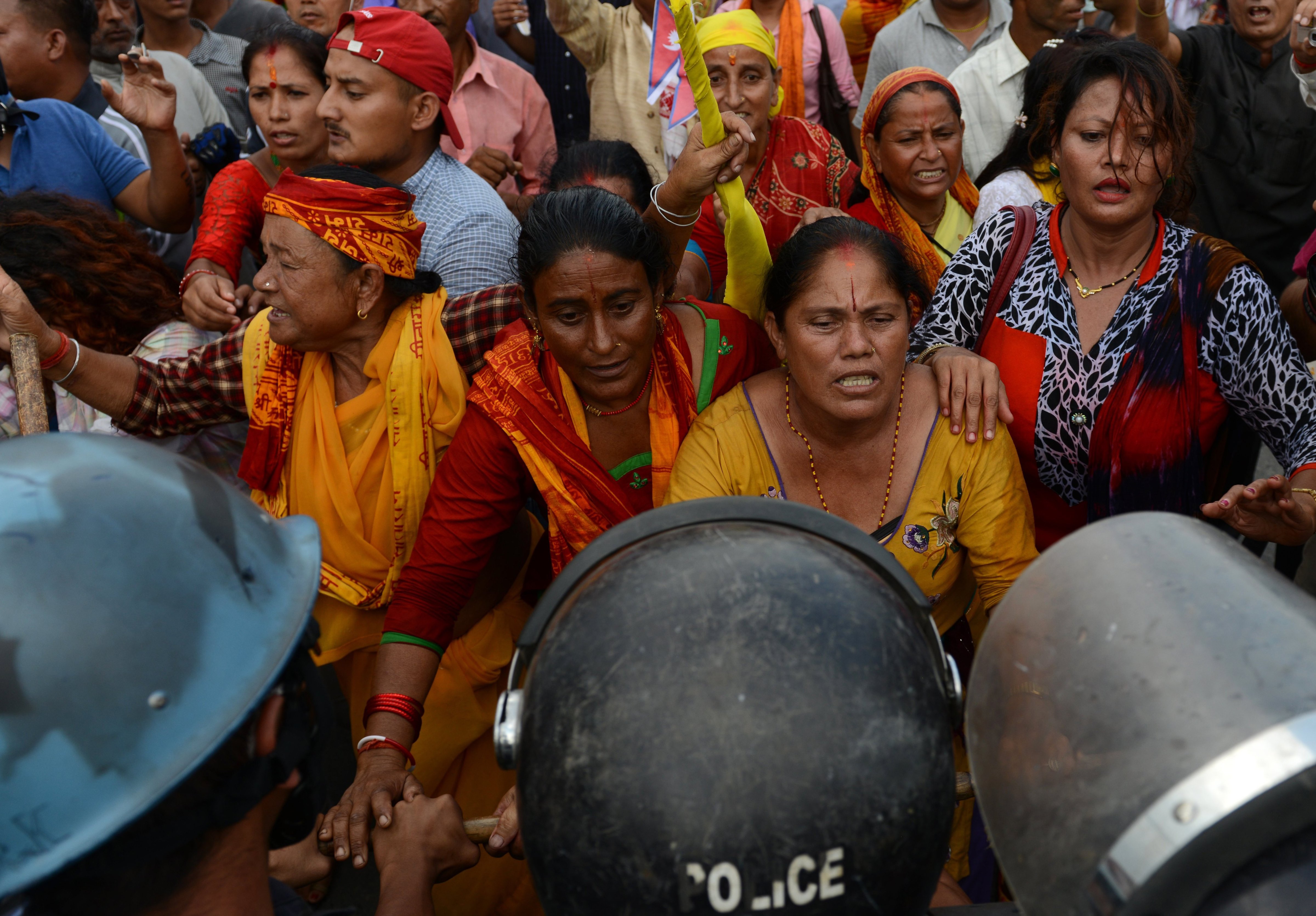 Nepalese police stop Hindu activists as they try to break through to a cordoned-off area near parliament during a protest demanding Nepal be declared a Hindu state in Kathmandu on September 1, 2015.