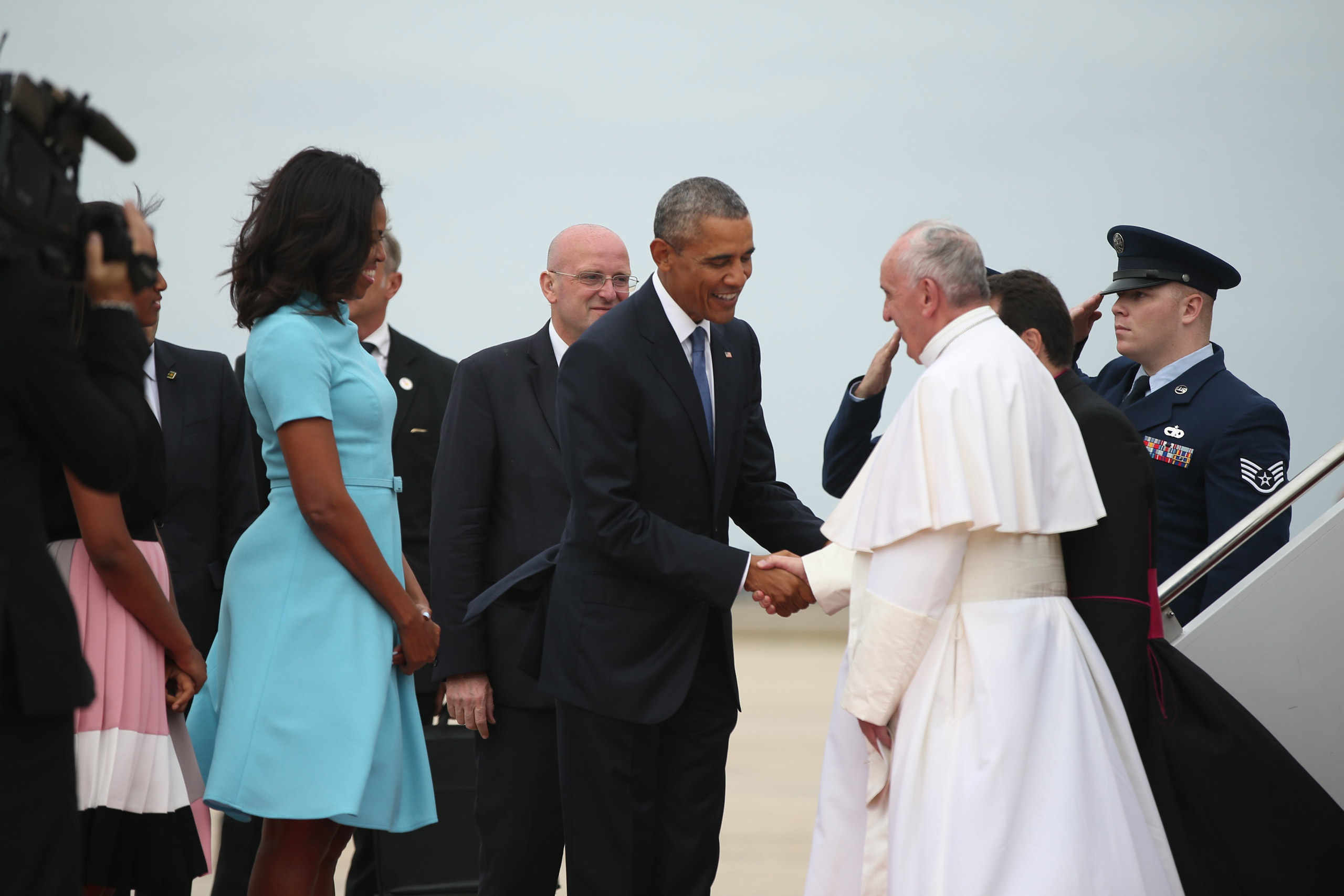 President Barack Obama and first lady Michelle Obama greet Pope Francis upon his arrival at Andrews Air Force Base, Md., on Sept. 22, 2015. (Andrew Harnik—AP)