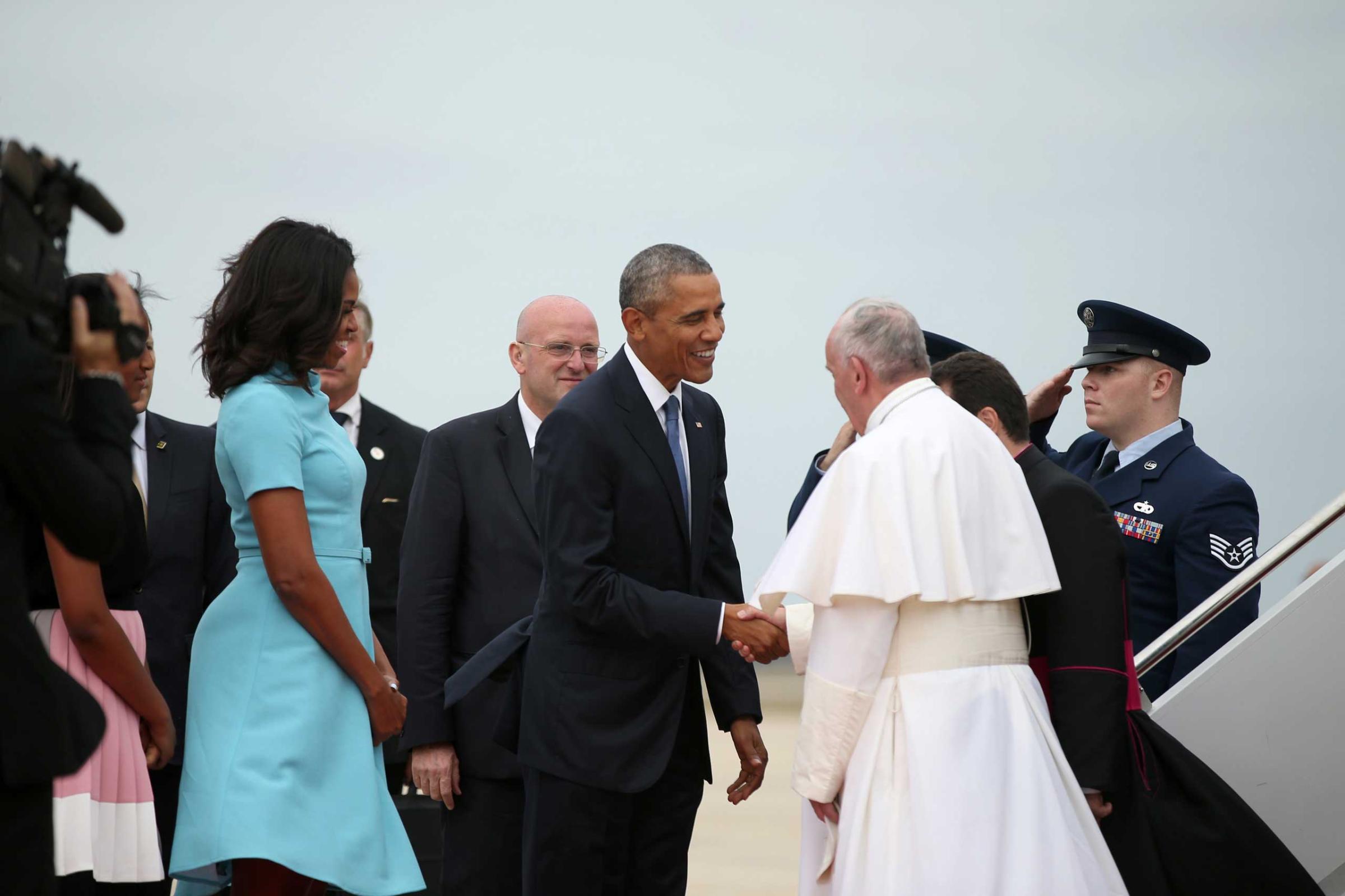 President Barack Obama, first lady Michelle Obama, and others, greet Pope Francis upon his arrival at Andrews Air Force Base, Md., on Sept. 22, 2015.