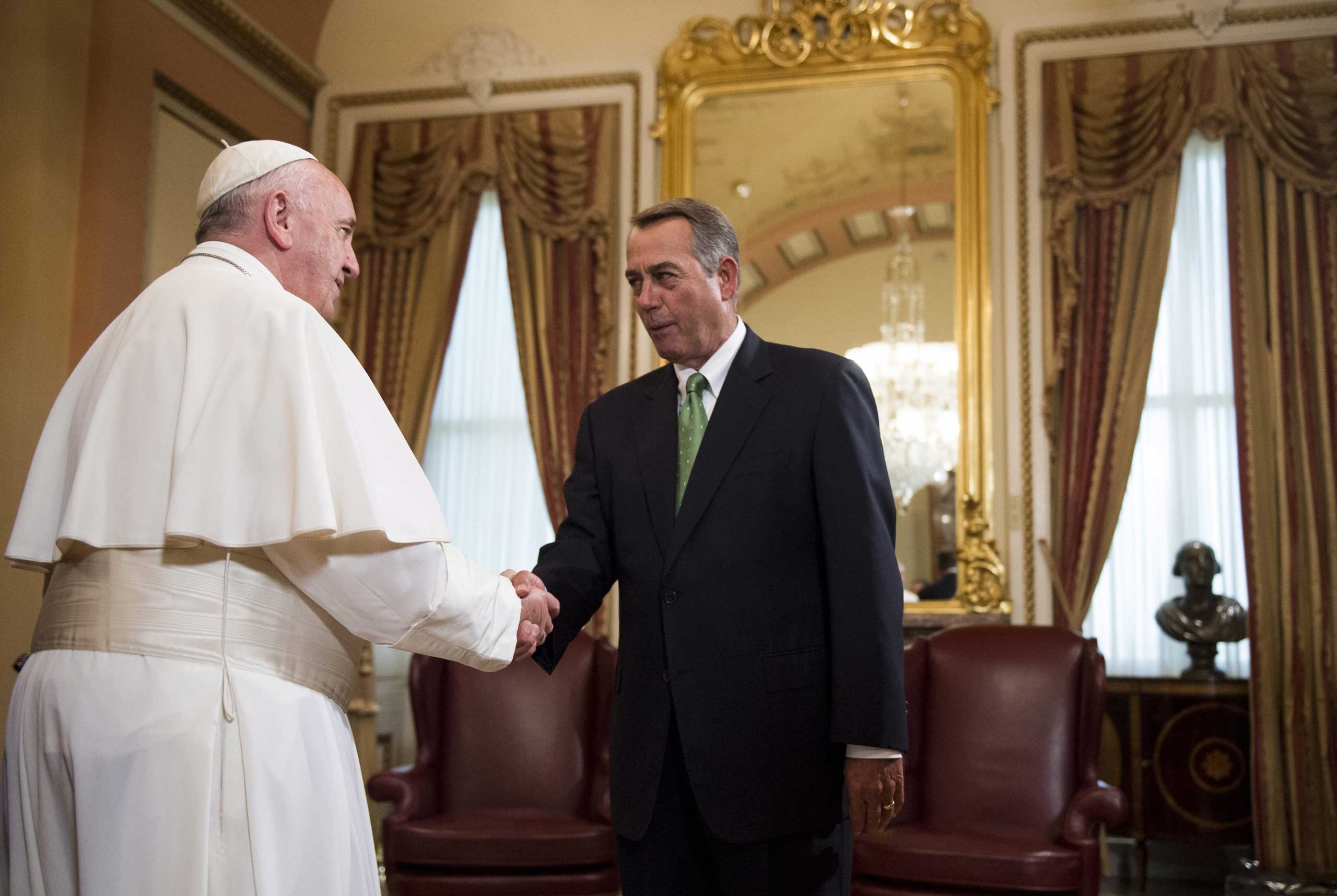 Pope Francis and Speaker of the House John Boehner speak in the US Capitol building as the Pope arrives to deliver his speech to a joint meeting of Congress in Washington, on Sept. 24, 2015.