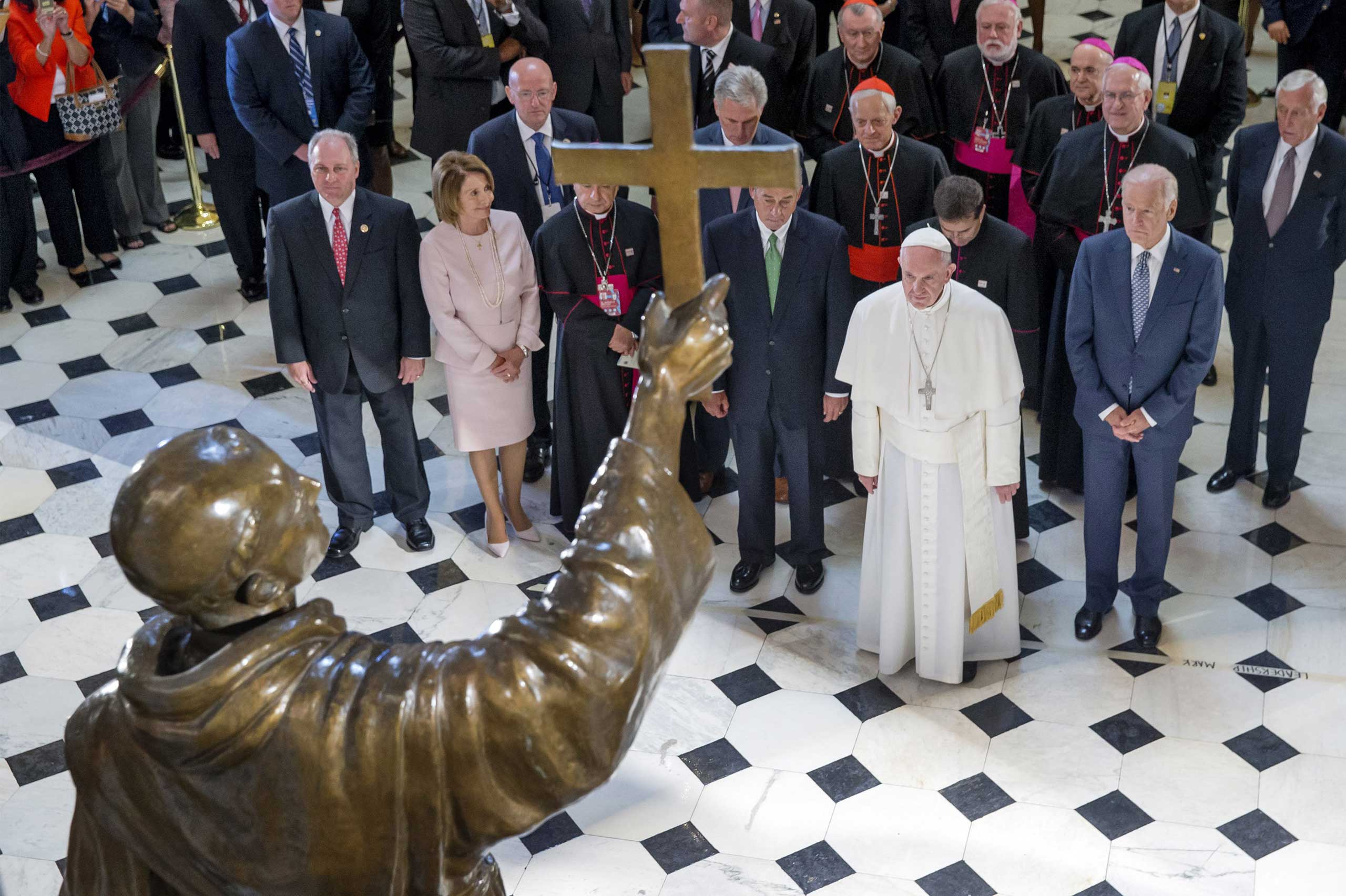 Pope Francis pauses in front of a sculpture of Spanish-born Junipero Serra, the Franciscan Friar known for starting missions in California, in Statuary Hall at the U.S. Capitol in Washington, on Sept. 24, 2015