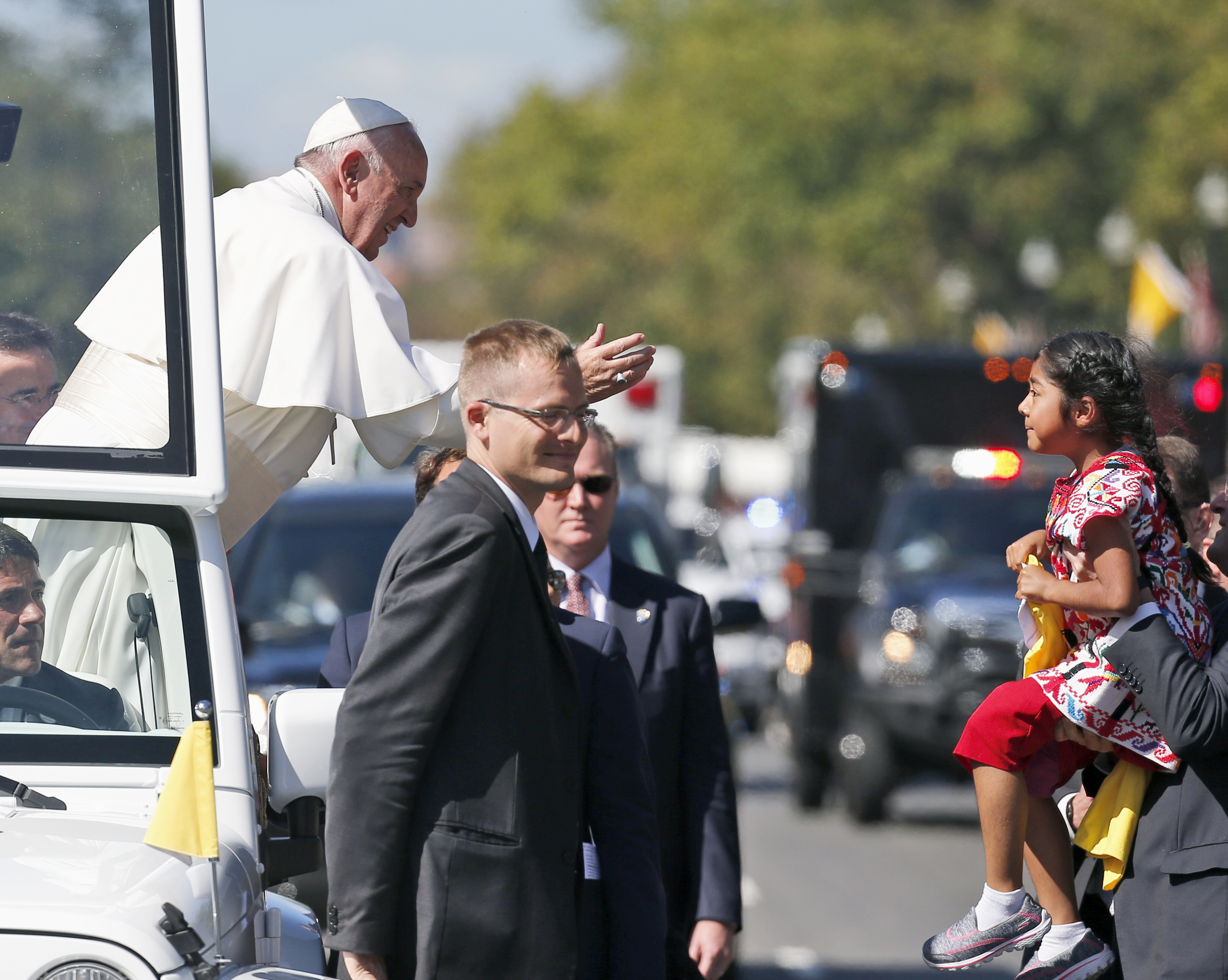 Pope Francis reaches to give a blessing to Sophie Cruz, 5, from suburban Los Angeles, during a parade in Washington on Sept. 23, 2015. (Alex Brandon—AP)