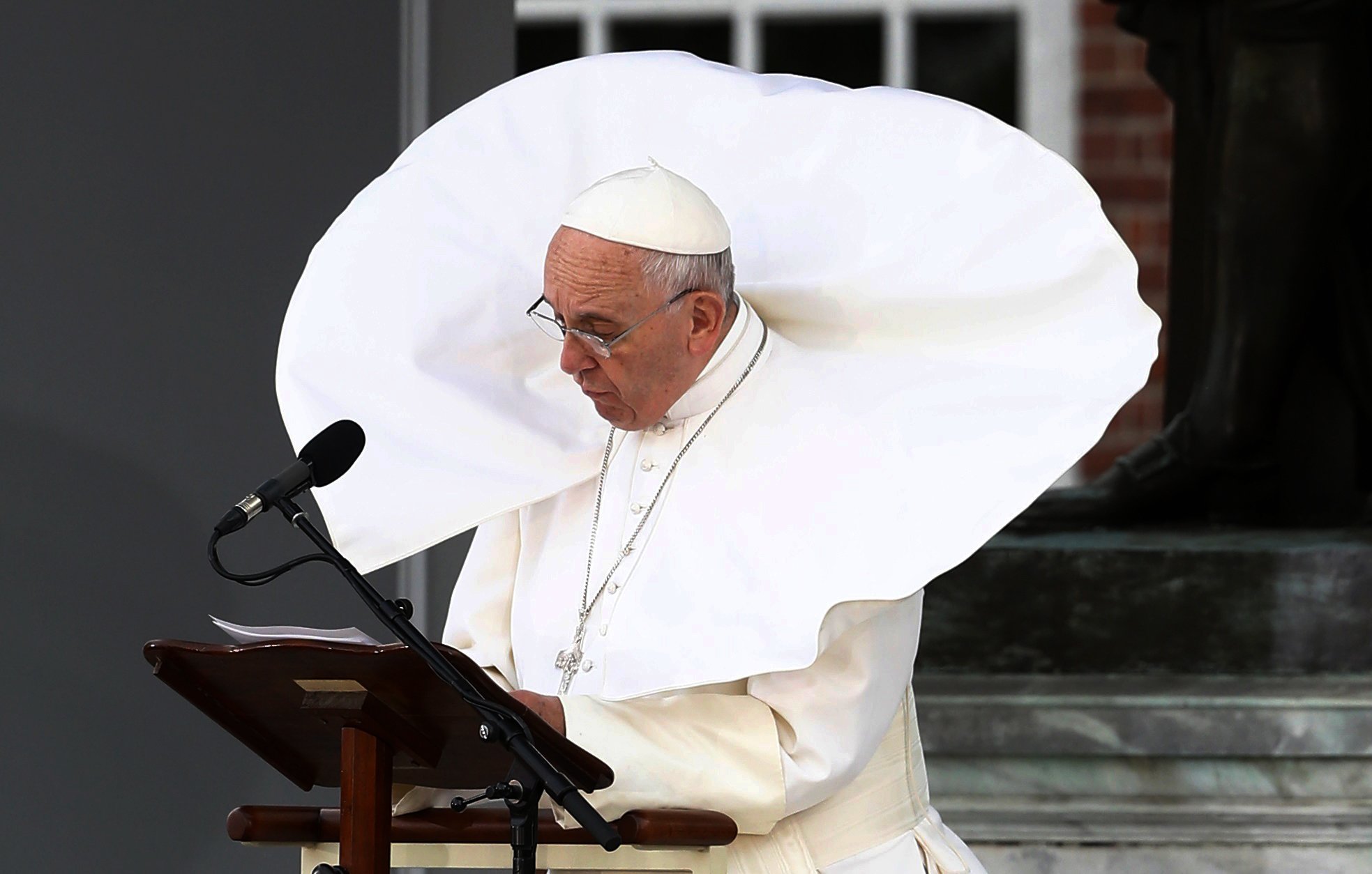 The wind lifts Pope Francis' mantle as he delivers his speech in front of Independence Hall in Philadelphia, on Sept. 26, 2015.