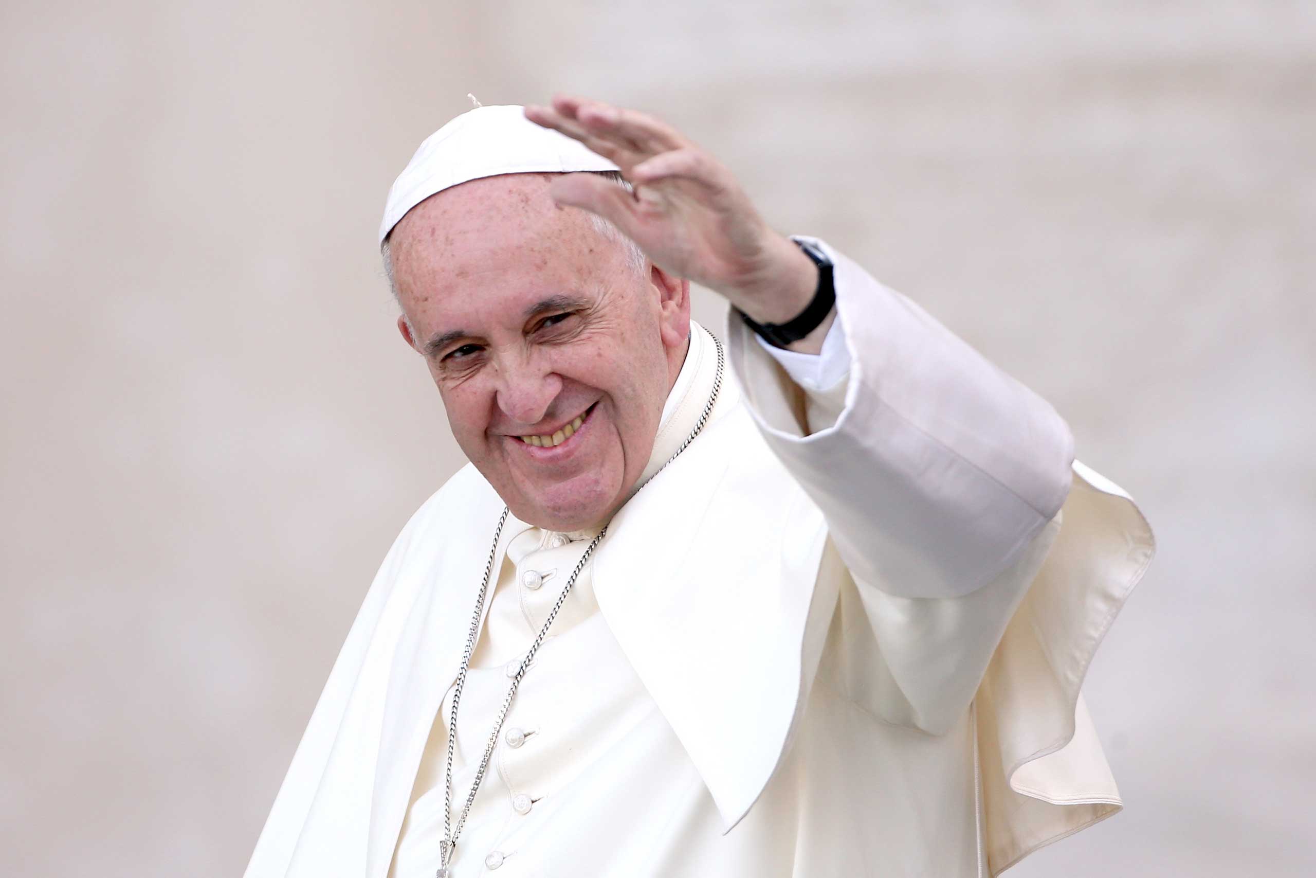 Pope Francis waves as he arrives in St. Peter's Square for an audience with thousands of altar servers from around Europe on August 4, 2015 in Vatican City, Vatican. (Franco Origlia—Getty Images)