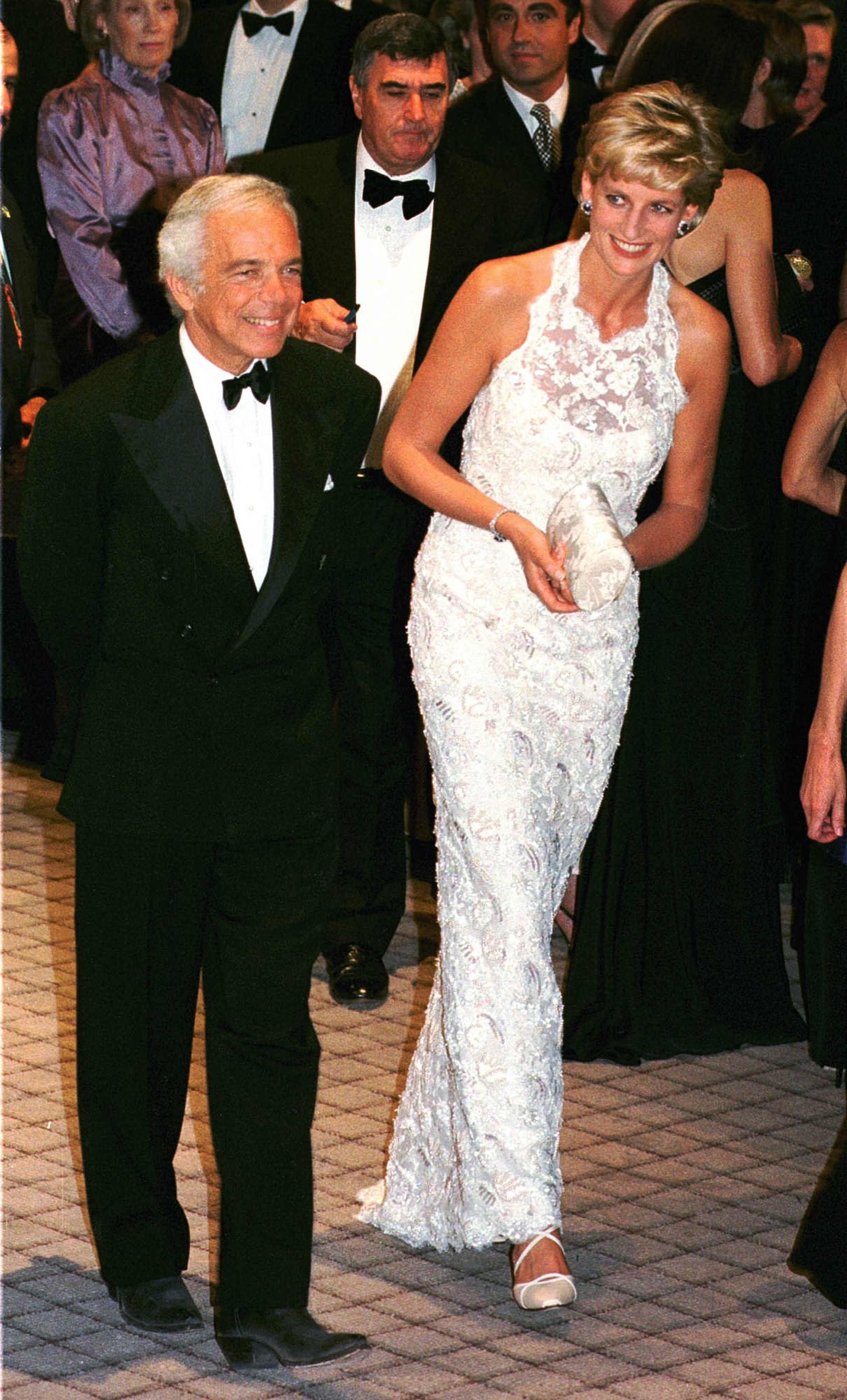 Princess Diana is escorted by fashion designer Ralph Lauren during an event at the National Building Museum on Sept. 24, 1996 in Washington.