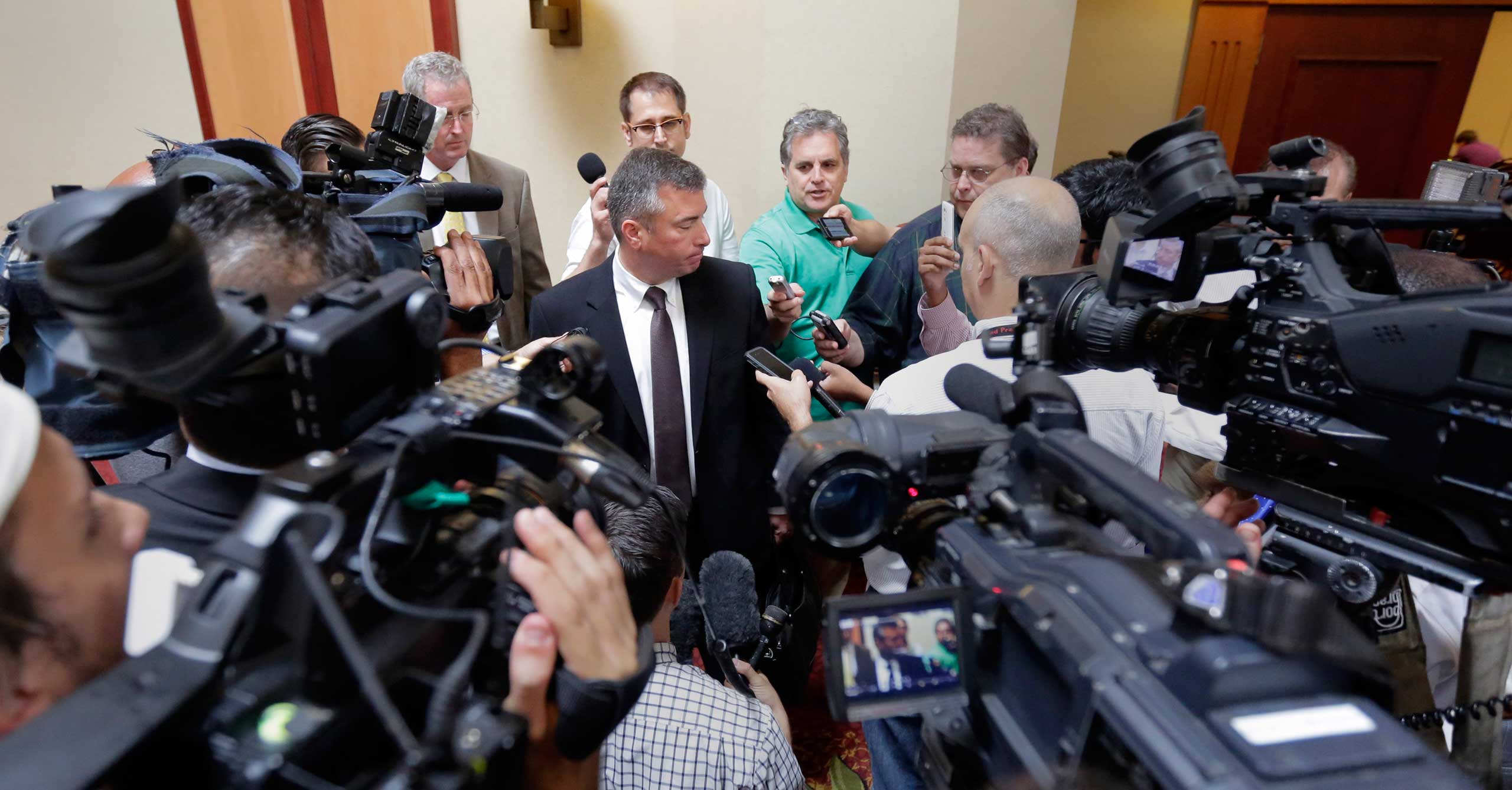 Northside Independent School District superintendent Brian Woods, center, talks to the media following an emergency meeting of the University Interscholastic League (UIL) State Executive Committee, in Round Rock, Texas, Sept. 9, 2015 (Eric Gay&mdash;AP)