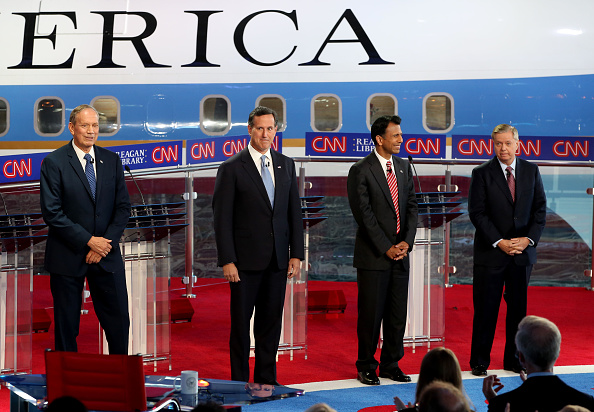 Republican presidential candidates former NY Governor George Pataki,former PA Senator Rick Santorum,LA Governor Bobby Jindal and SC Senator Lindsey Graham onstage during the Republican presidential debates at the Reagan Library in Simi Valley on September 16, 2015.