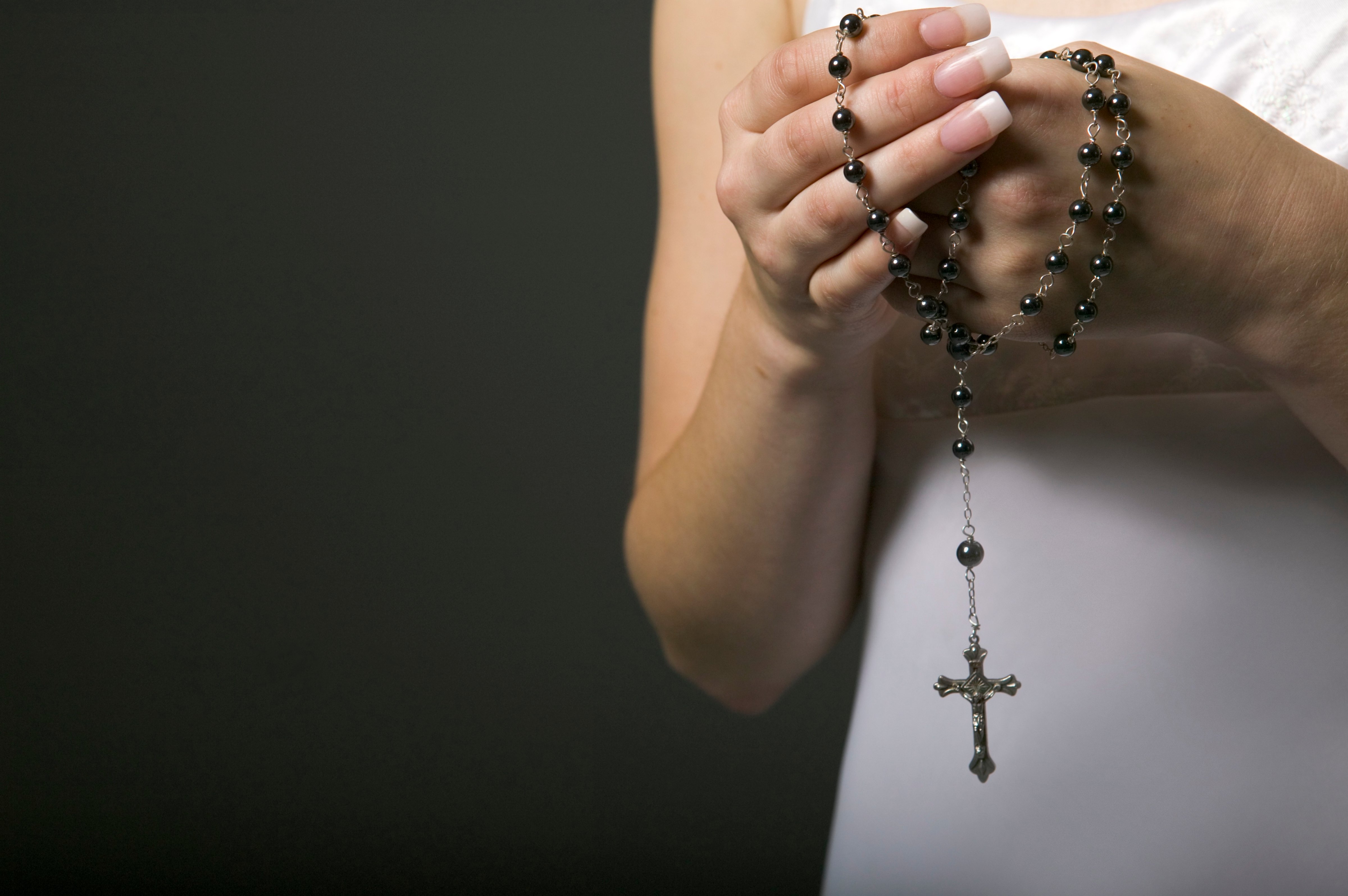 Woman holding rosary