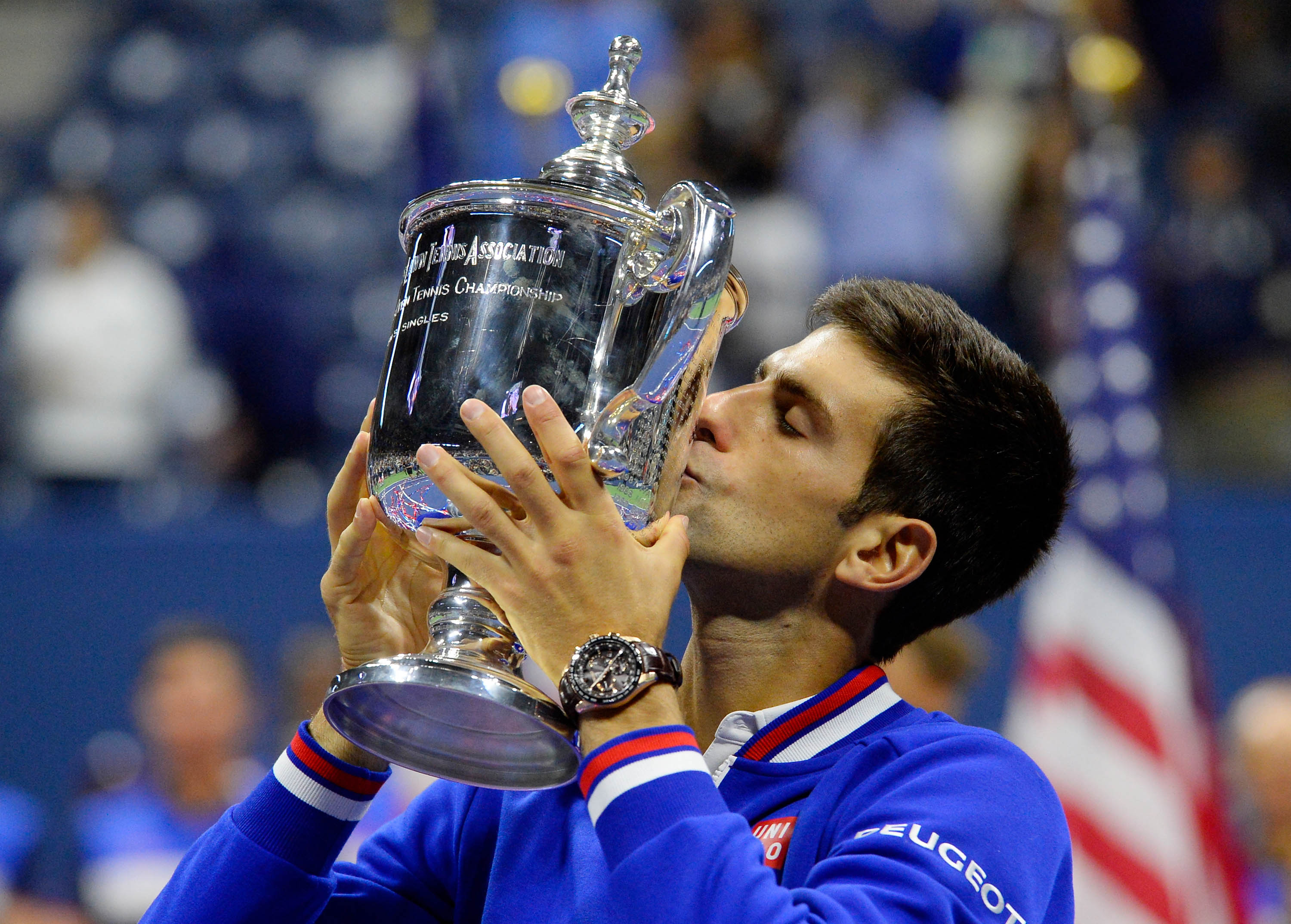Novak Djokovic kisses the U.S. Open Trophy after beating Roger Federer in the men's singles final at the USTA Billie Jean King National Tennis Center in New York on Sept. 13, 2015 (Robert Deutsch—USA Today Sports/Reuters)