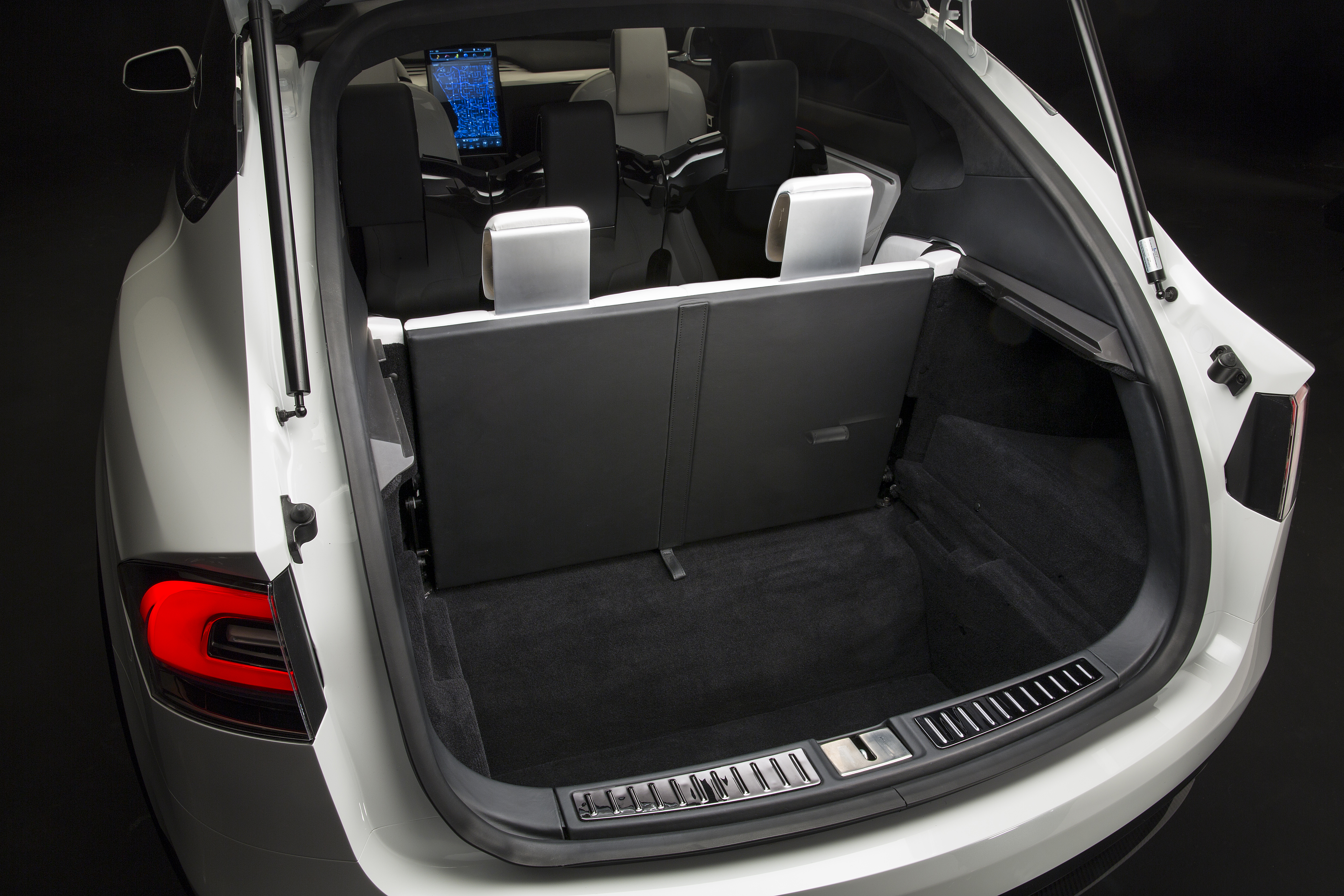 Expansive trunk space allows for a bicycle to fit in the back and two golf bags in the front trunk where the engine on a gasoline car would be.