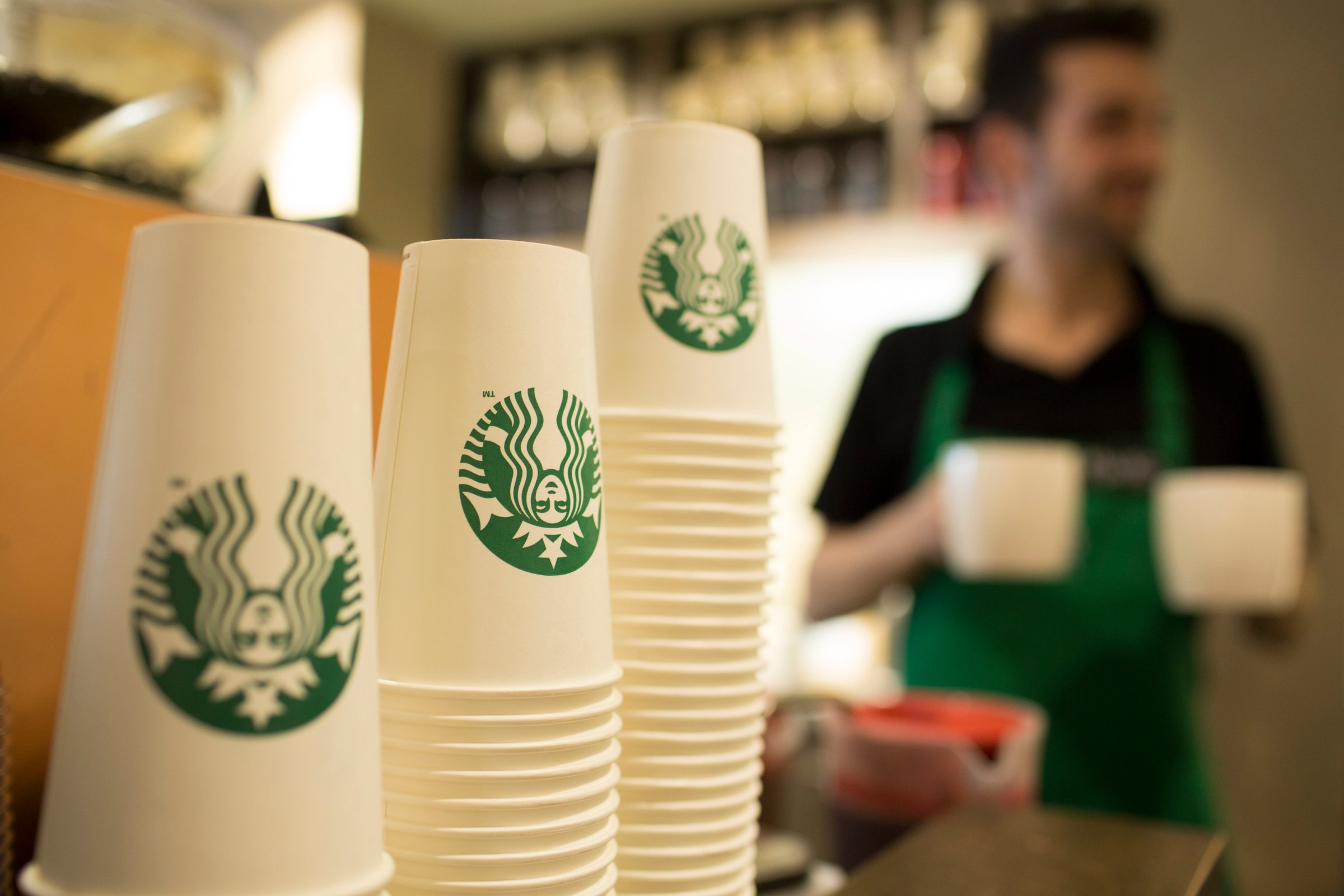 The Starbucks Corp. logo sits on cardboard coffee cups inside a Starbucks Corp. shop in London, U.K., on Monday, June 9, 2014.