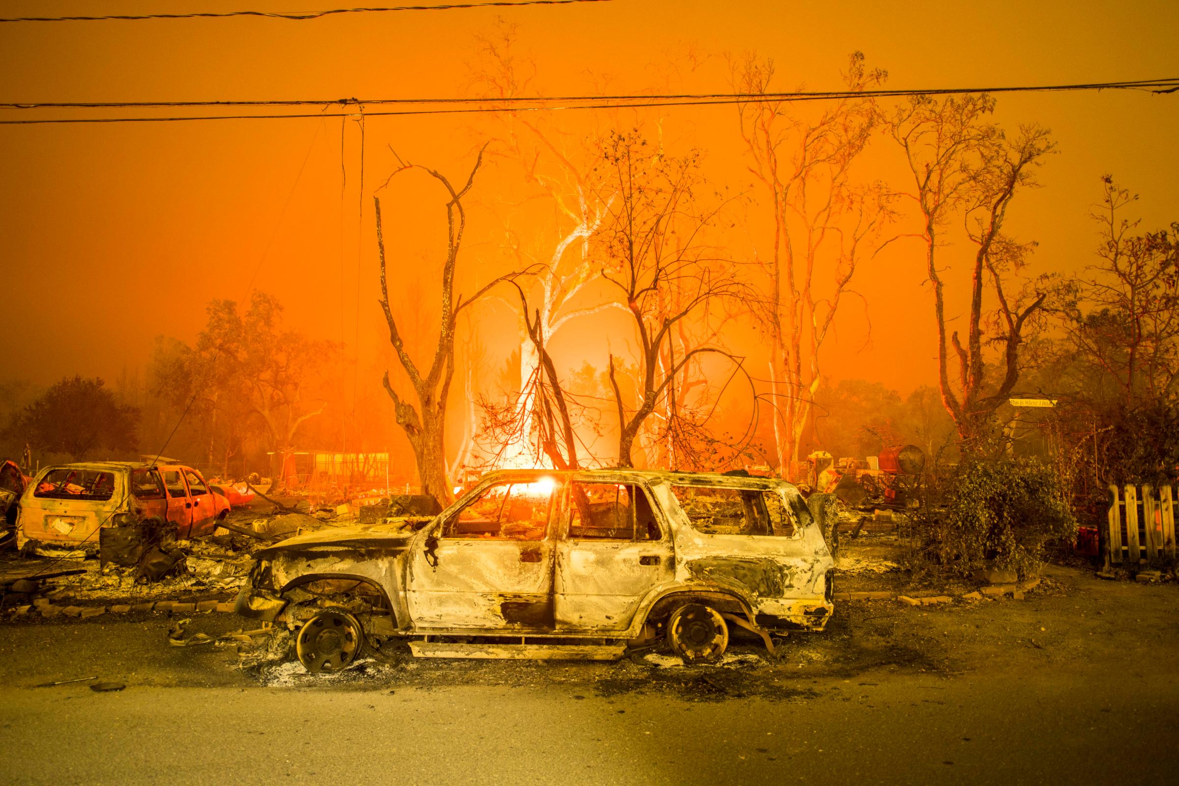 A burned out truck sits in front of a destroyed structure in Middletown, CA Sunday evening. Valley Fire in Lake and Sonoma Counties Sunday September 13th, 2015. As of Sunday evening the fire had burned over 50,000 acres and was 0% contained. The Associated Press reported that at least one person was killed due to the fire.