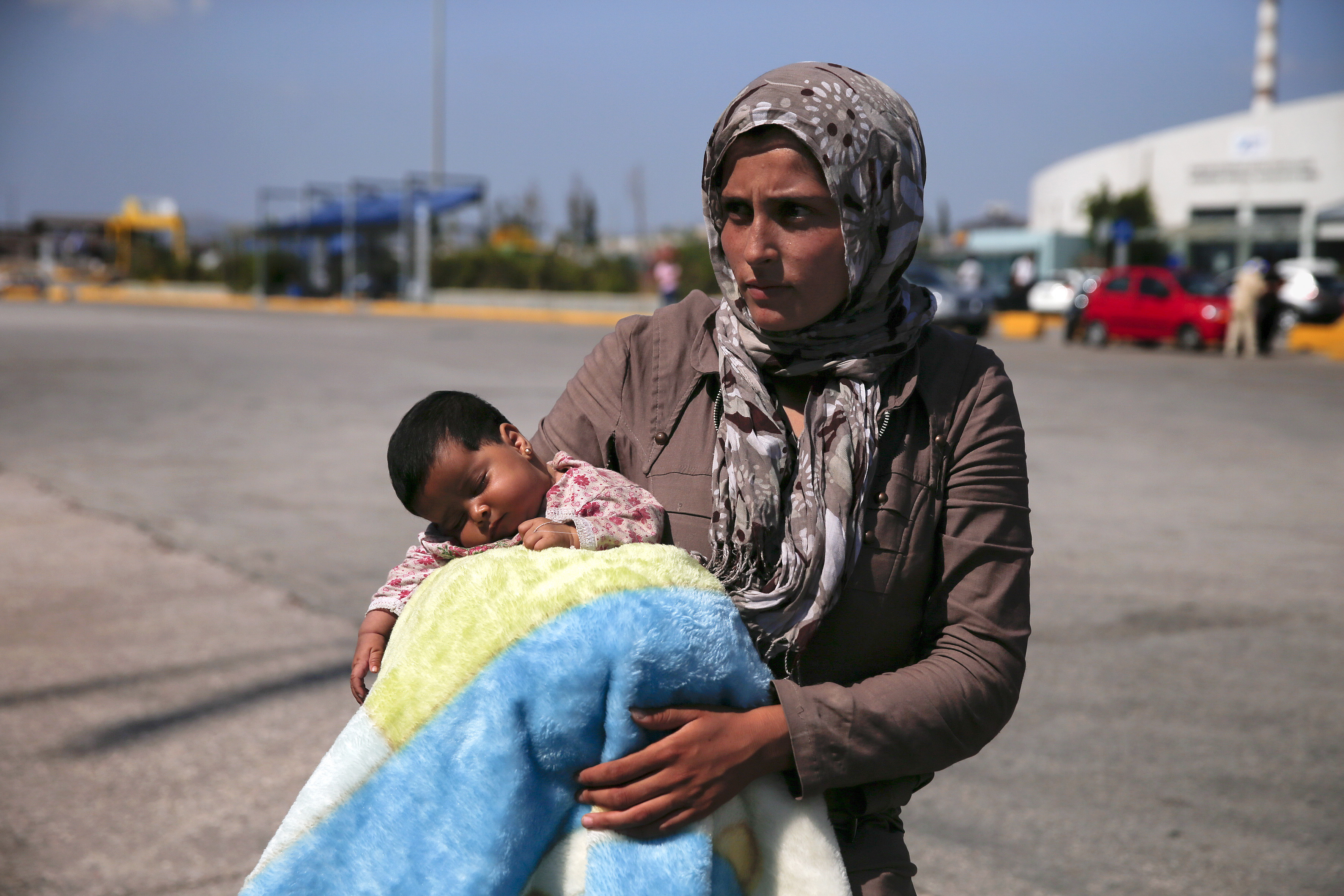 A Syrian refugee holds her baby following their arrival onboard the Eleftherios Venizelos passenger ship at the port of Piraeus, near Athens, Greece on Sept. 8, 2015. (Alkis Konstantinidis—Reuters)