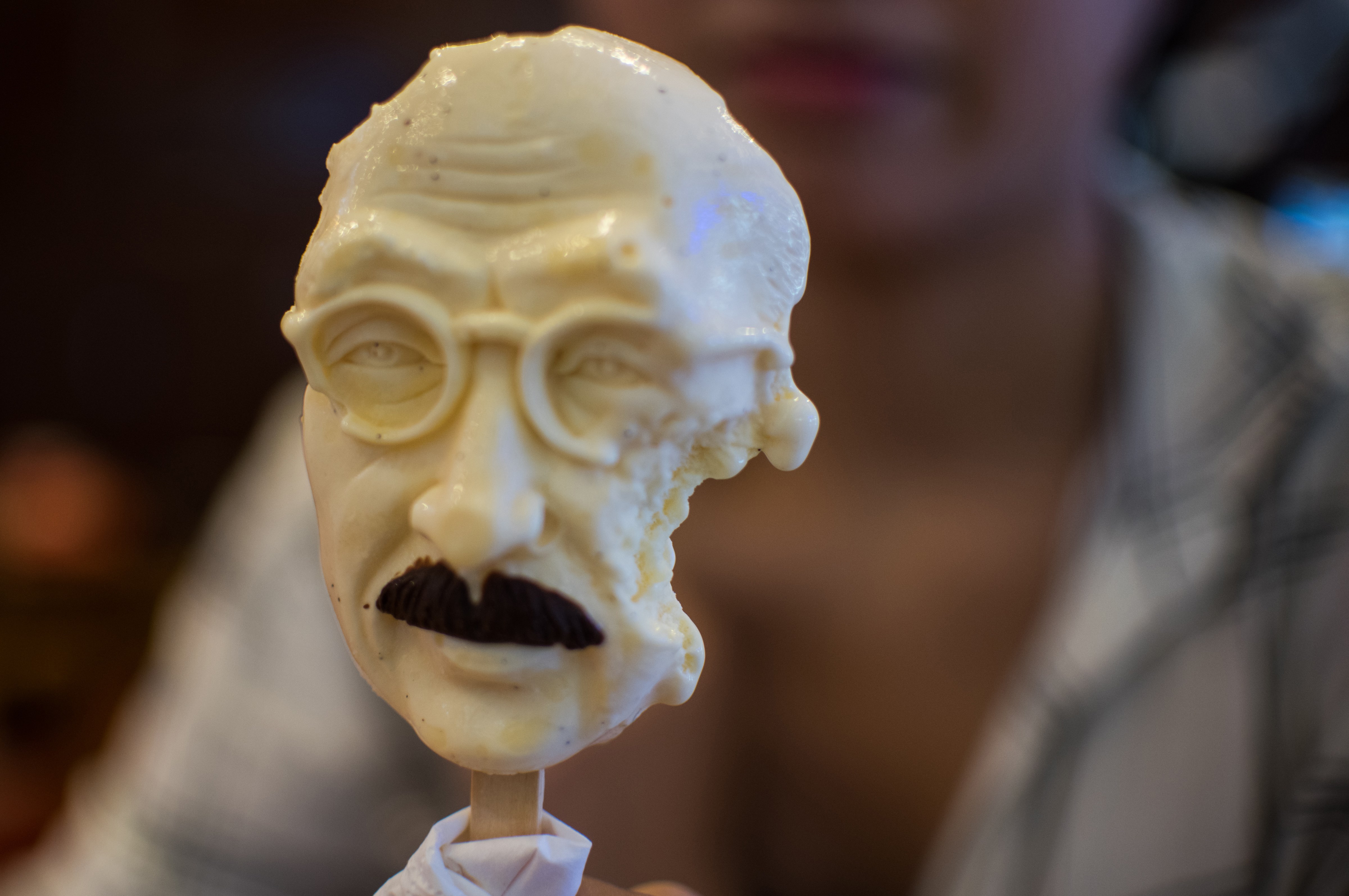 A woman sells an ice cream in the shape of executed Japanese war criminal Hideki Tojo at an ice cream store in Shanghai on Sept. 2, 2015 (Johannes Eisele—AFP/Getty Images)
