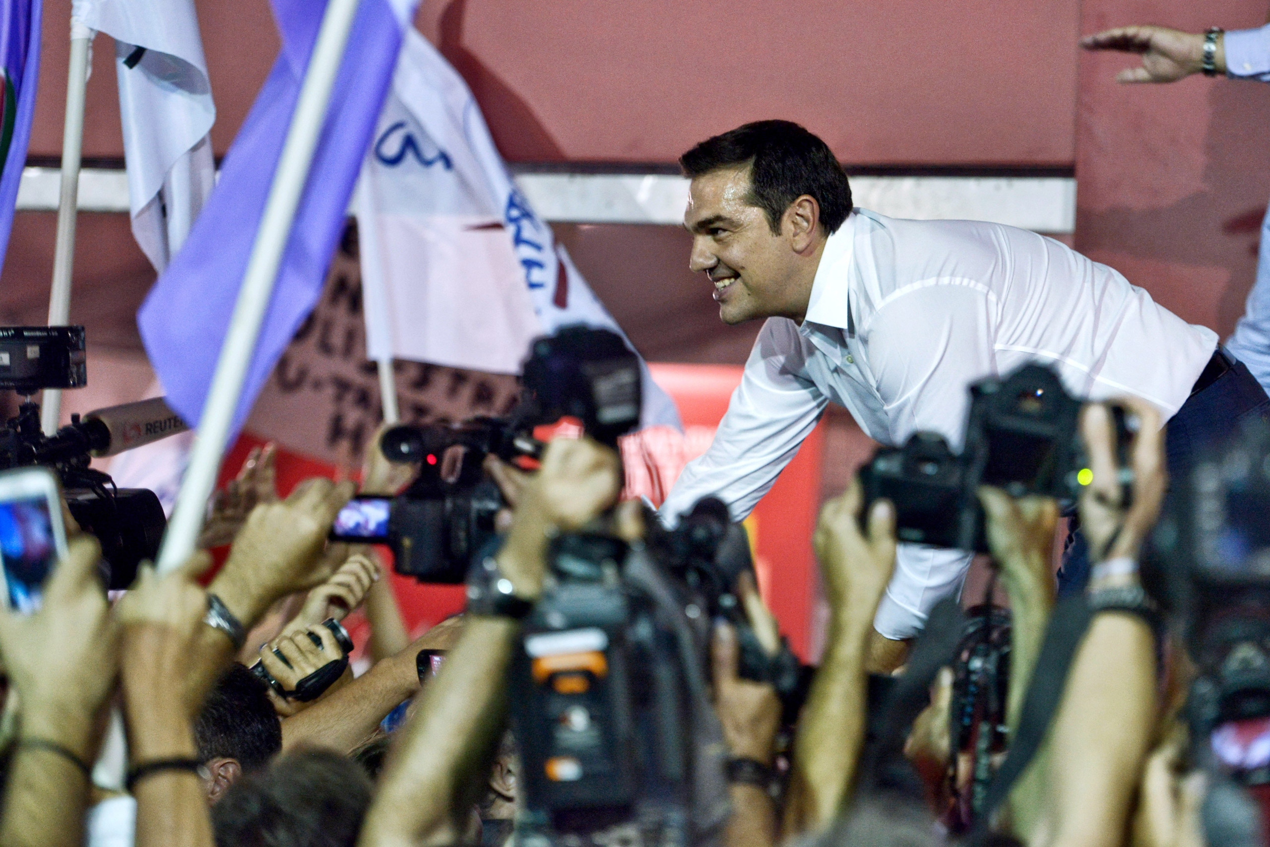 Former Greek prime minister and leader of leftist Syriza party Alexis Tsipras address supporters after winning the general election in Athens on Sept. 20, 2015. (Milos Bicanski—Getty Images)
