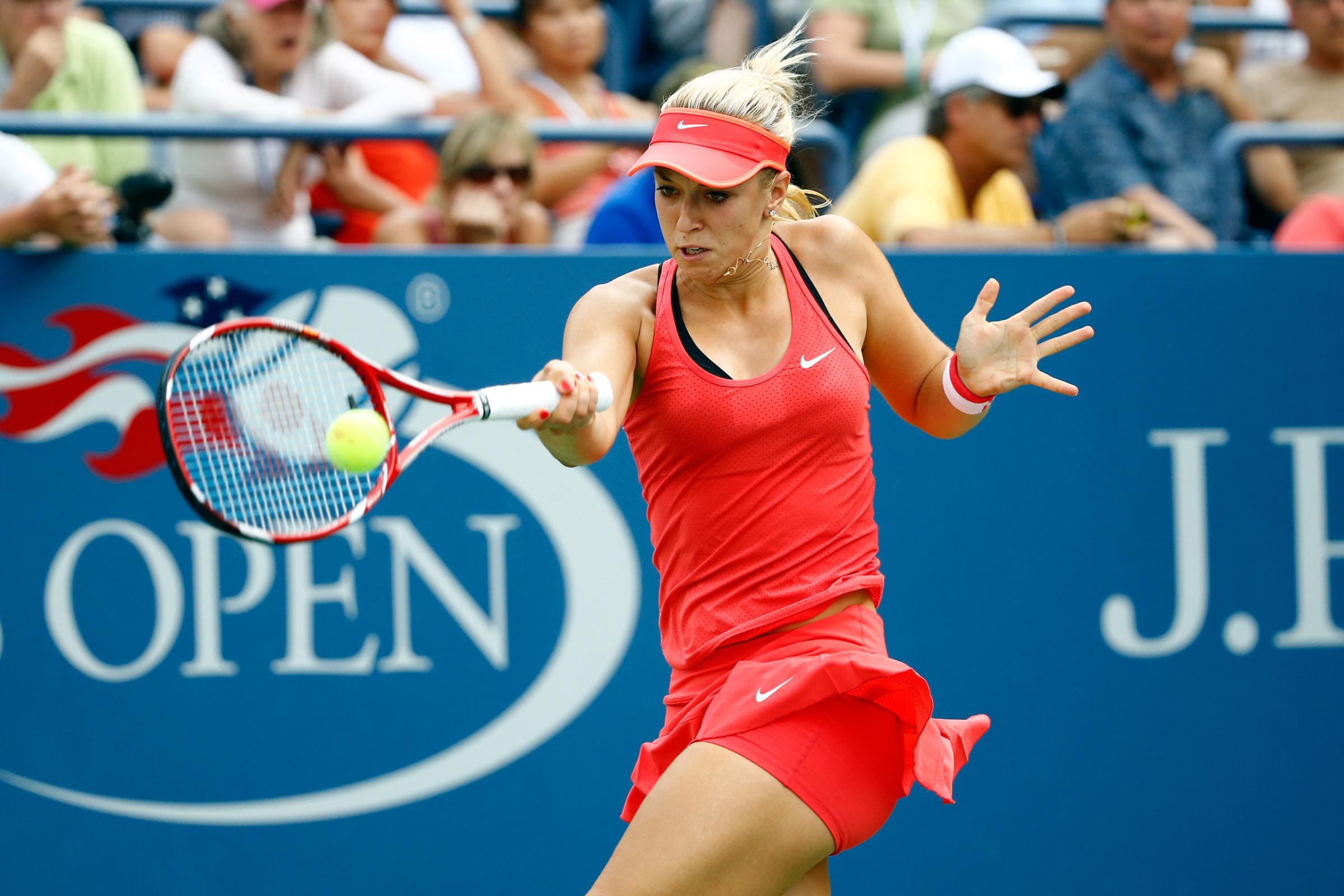NEW YORK, NY - SEPTEMBER 03: Sabine Lisicki of Germany returns a shot against Camila Giorgi of Italy during their Women's Singles Second Round match on Day Four of the 2015 US Open at the USTA Billie Jean King National Tennis Center on September 3, 2015 in the Flushing neighborhood of the Queens borough of New York City. (Photo by Al Bello/Getty Images)