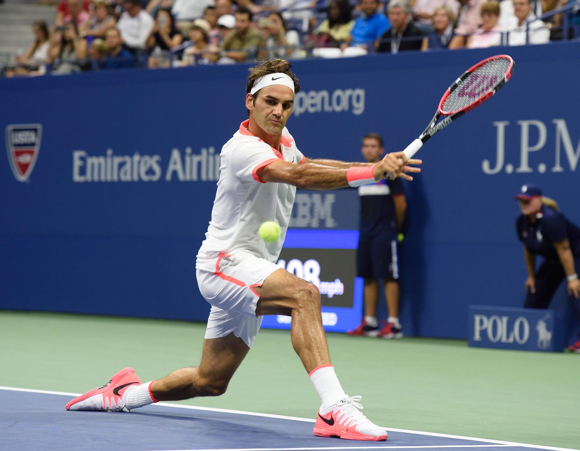 Roger Federer of Switzerland hits a return to Steve Darcis of Belgium during the 2015 US Open men's singles round two match at the USTA Billie Jean King National Tennis Center September 3, 2015 in New York. AFP PHOTO / DON EMMERT (Photo credit should read DON EMMERT/AFP/Getty Images)