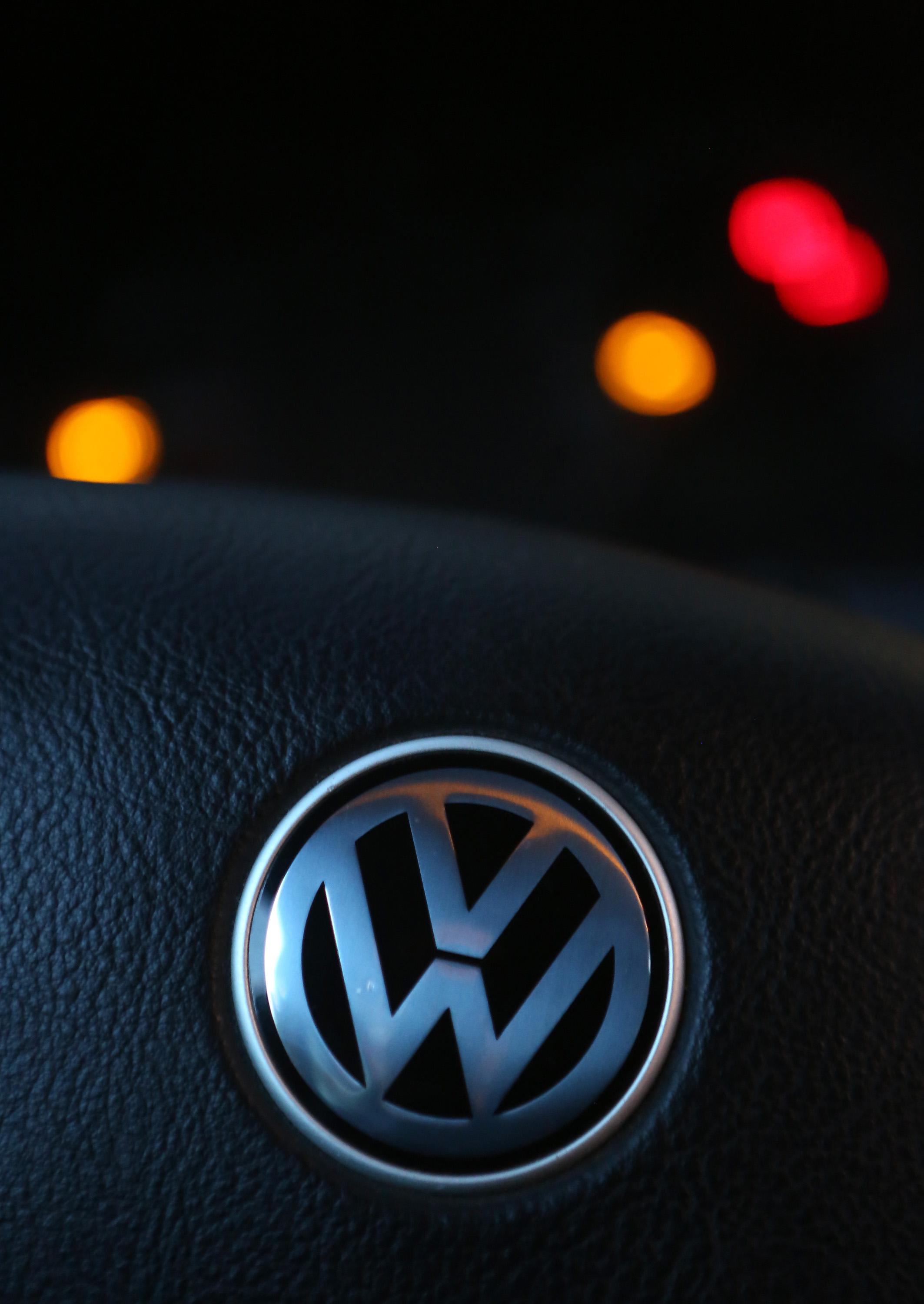 A Volkswagen (VW) logo is seen on the steering wheel of one of the Volkswagen cars in Berlin on Sept. 18, 2015. (Adam Berry—Getty Images)