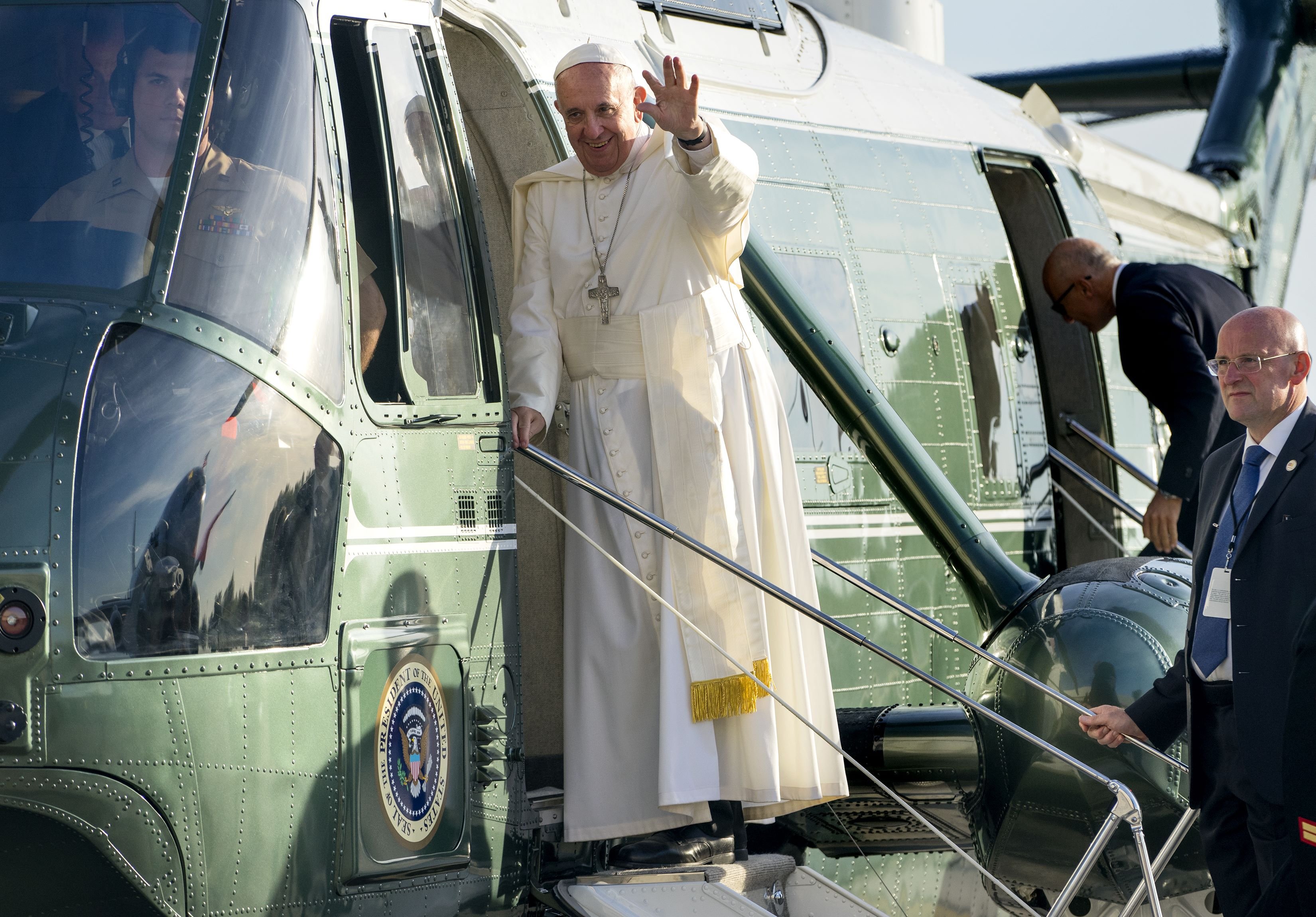 Pope Francis waves to supporters as he arrives at John F. Kennedy International Airport in New York, on Sept. 24, 2015.