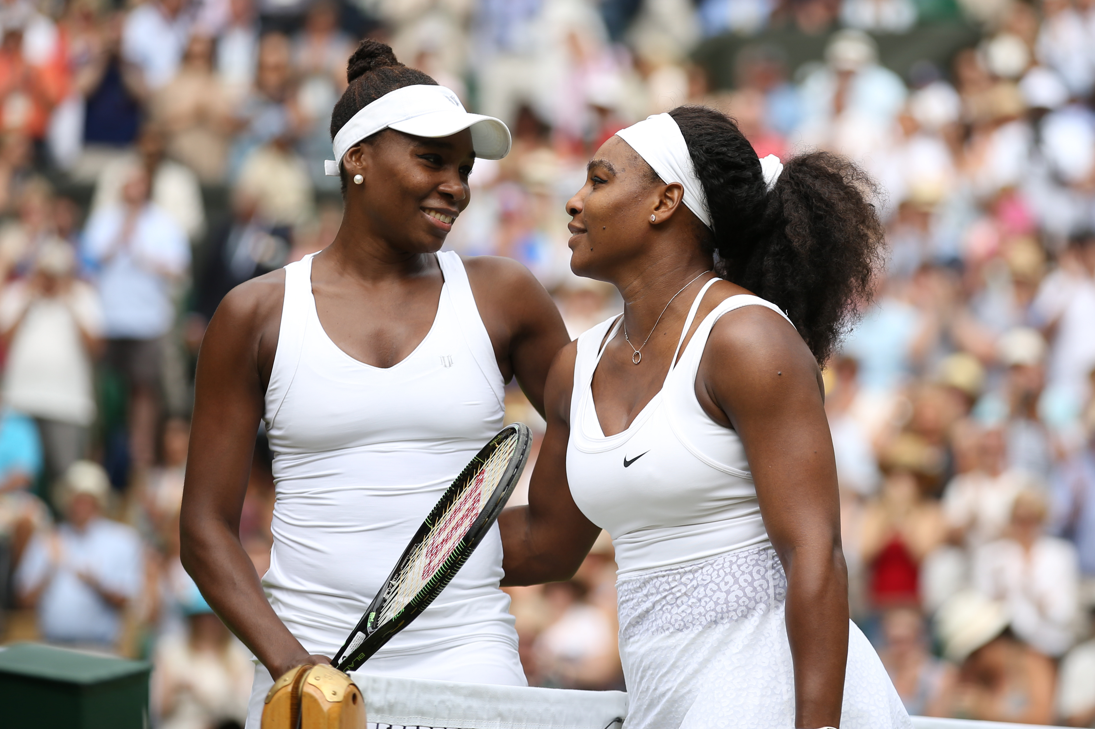 It's war — and yet not: Venus, left, and Serena Williams at Wimbledon in July 2015 (Mark Leech—Getty Images)
