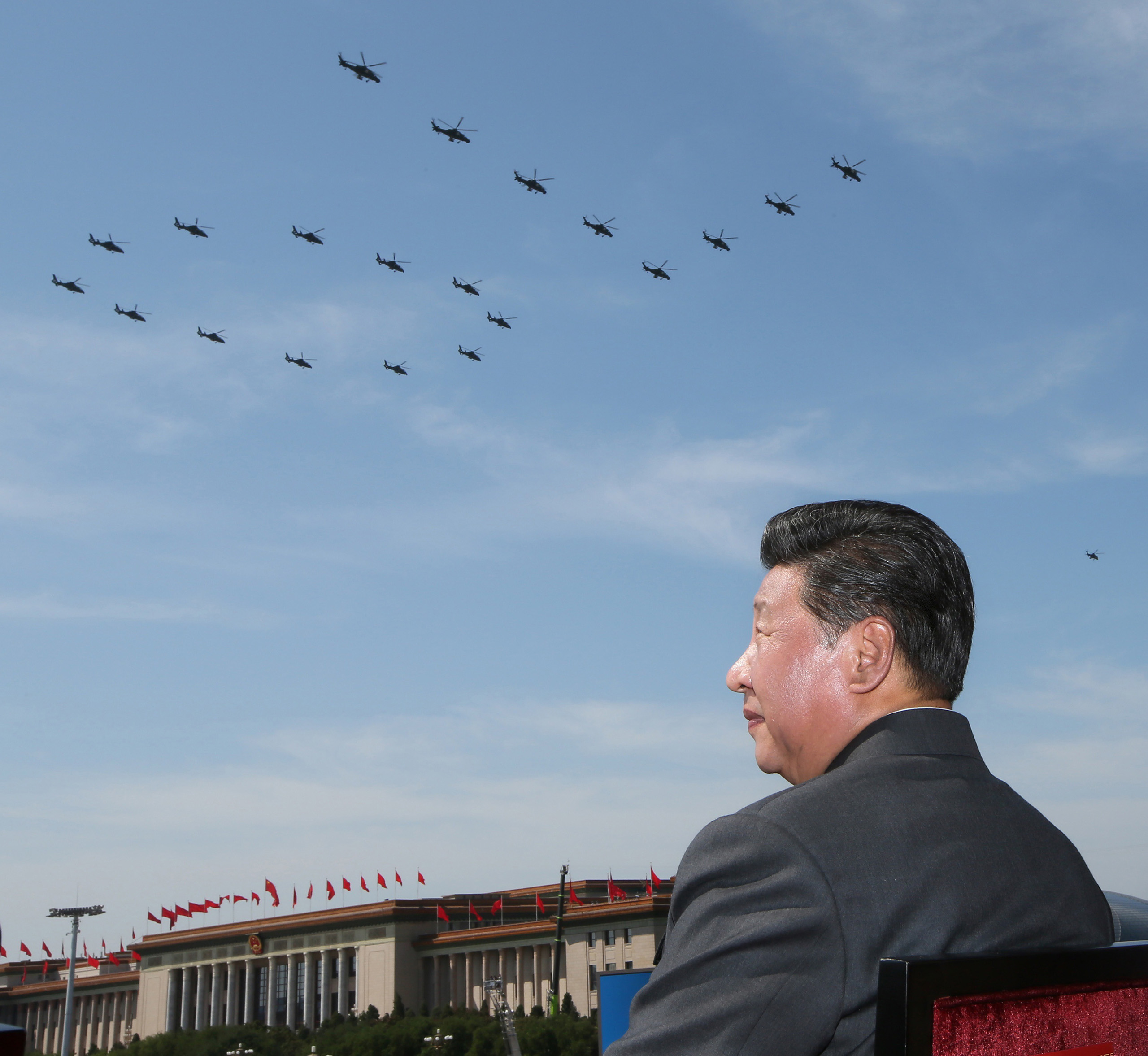 Chinese leader Xi Jinping watches a helicopter fly past, part of a big military parade on Sept. 3 at Beijing’s historic Tiananmen Square. (Lan Hongguang—Xinhua/Getty Images)