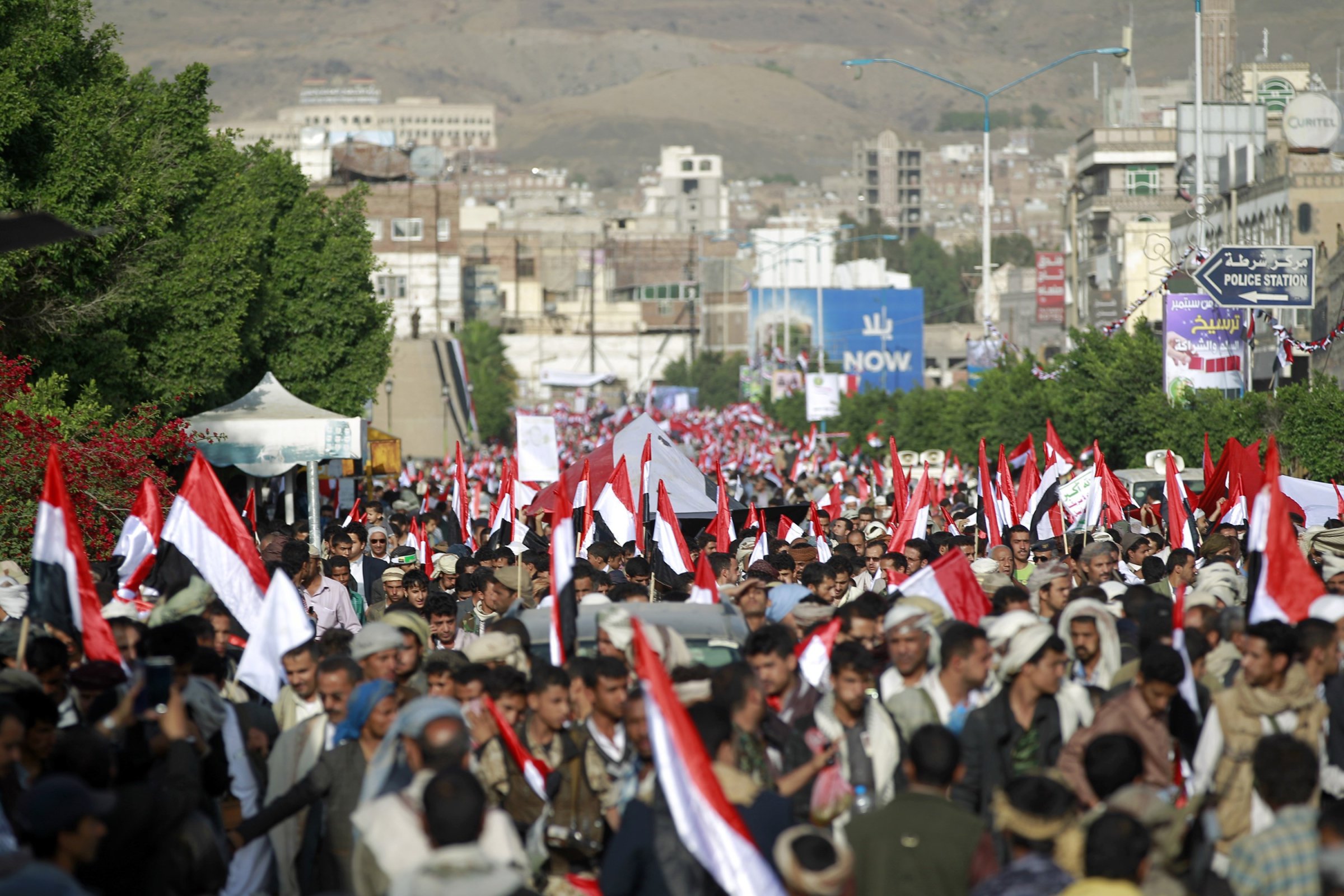 Yemeni supporters of the Shiite Huthi rebel movement hold national flags in the capital Sanaa on Sept. 21, 2015.