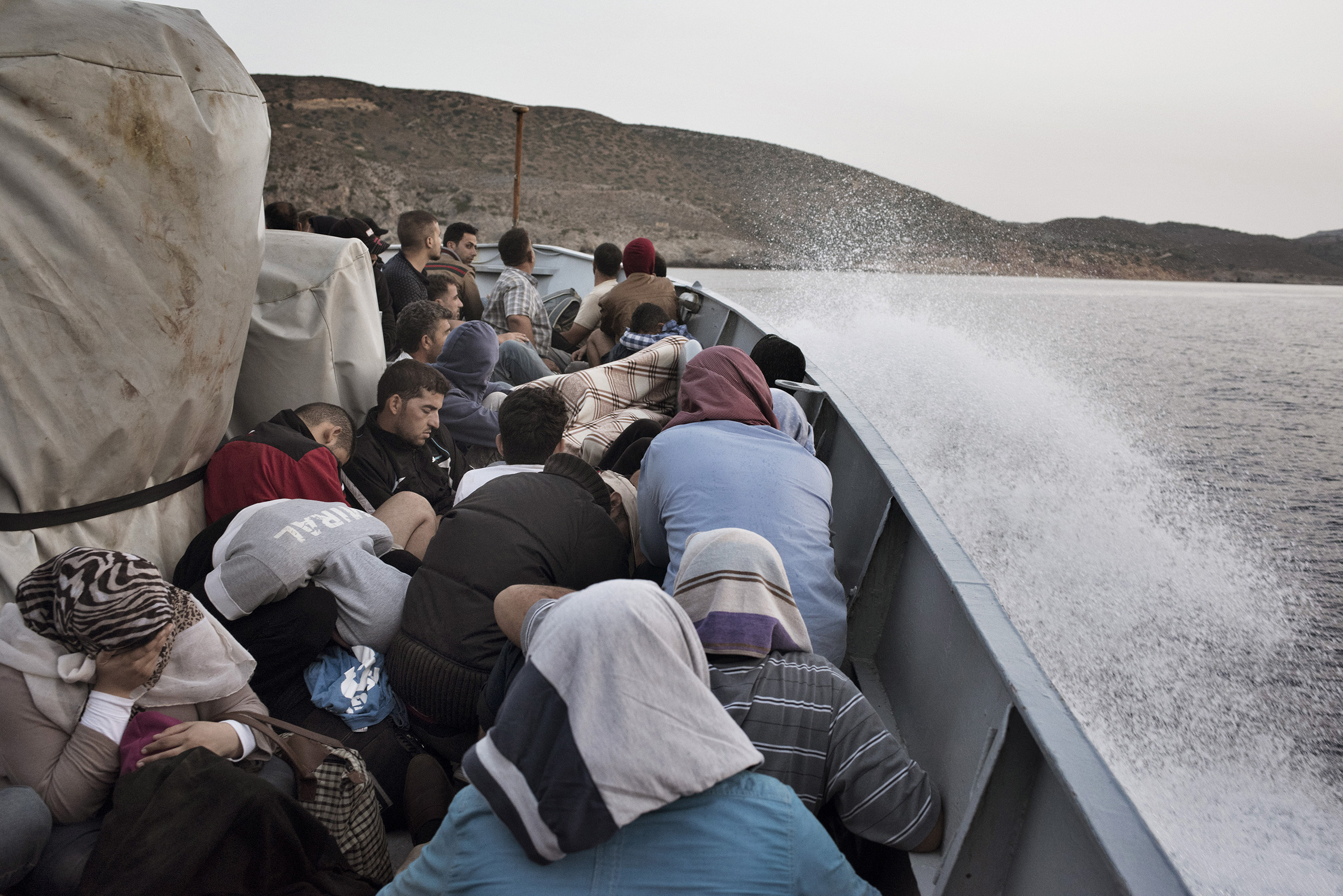 Syrian migrants are taken to Greece aboard a Greek coast guard vessel after it rescued them from waters near the Greek-Turkish border. Sept. 7, 2015.