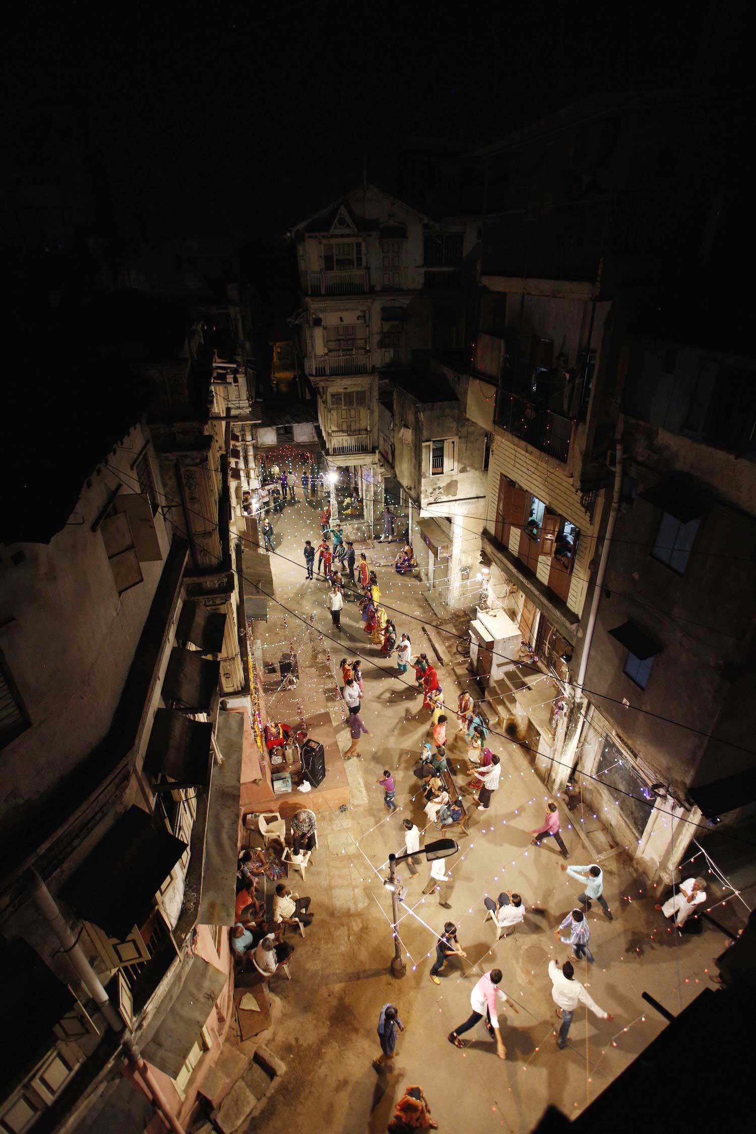 Old part of town (pols) Traditional neighborhoods and oldest part of Ahmedabad, the capital of Gujarat. Pols consist out of many small communities, grouped by cast or profession. I asked locals for their permission to climb their rooftops, or enter their bedrooms to get this viewpoint.