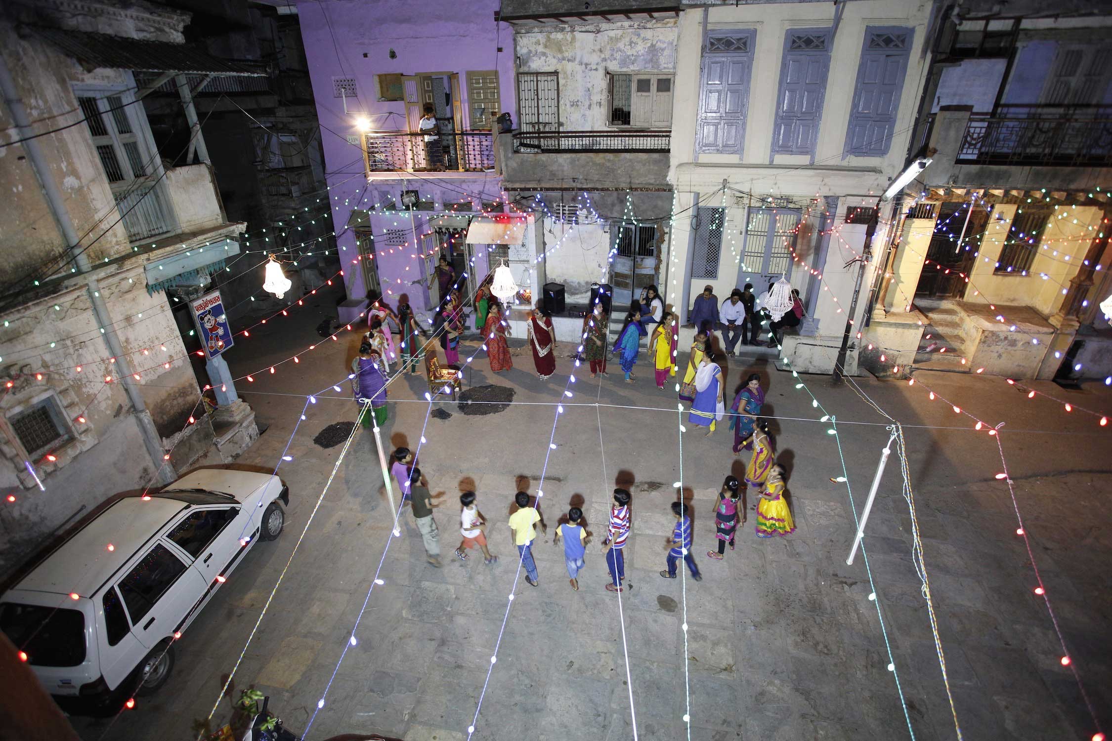 A “pol” community dances in their courtyard, the place decorated for the festivity with many LED lights and chandeliers. Many Gujaratis emigrated to the US, especially to the New York City and New Jersey area. Many of them return to their home state for the holidays and join their families. People are dancing all night, and often the celebration ends at dawn, with a breakfast, eating the blessed food.