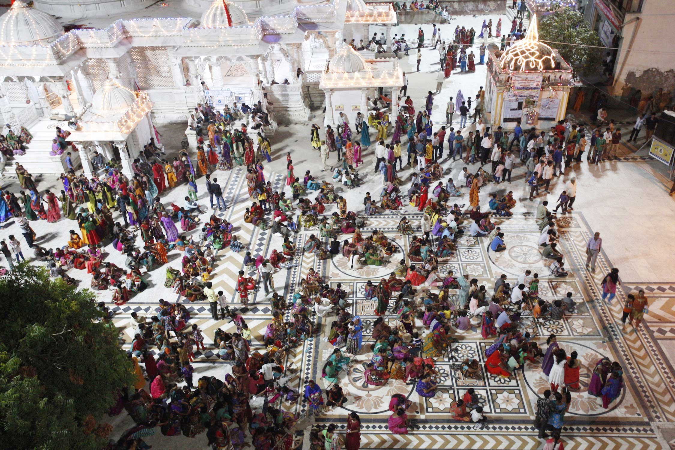 An remote temple in the North East of Gujarat on the 8th day of Navratri. After the Aarti, a huge circle was formed and everybody is dancing around the entire temple complex. In the middle are women from neighboring villages and tribal areas, farmers who visited the temple for the celebration.